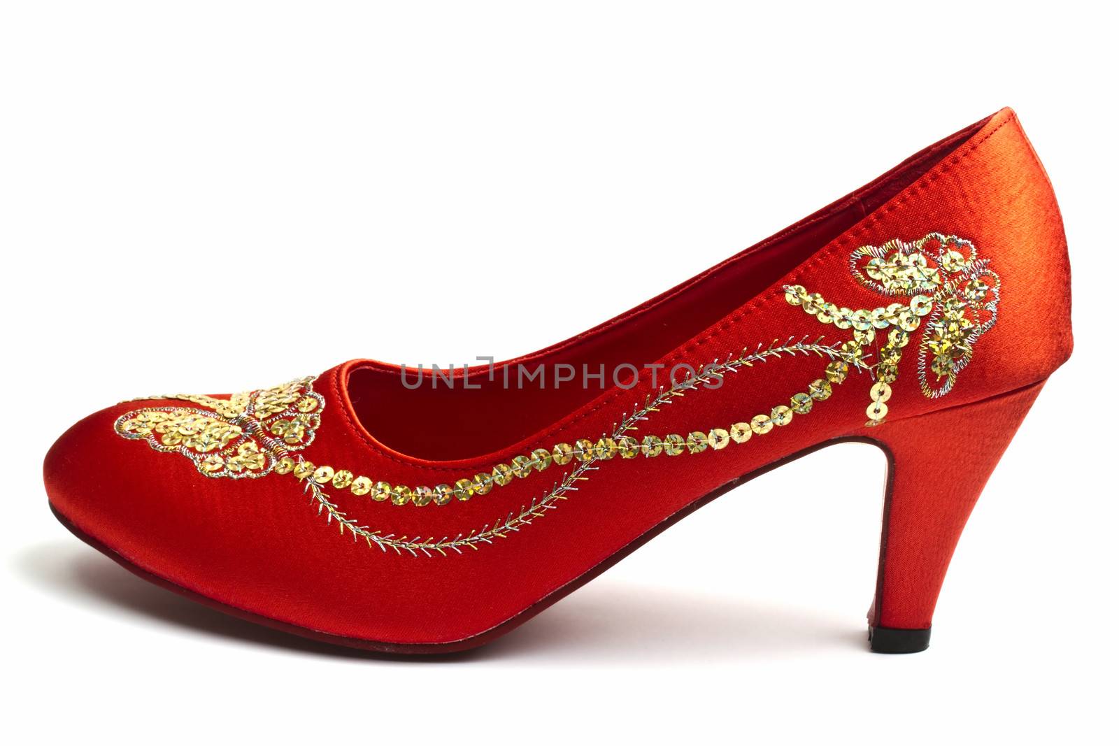 Beautiful chinese embroidered wedding shoe isolated on white