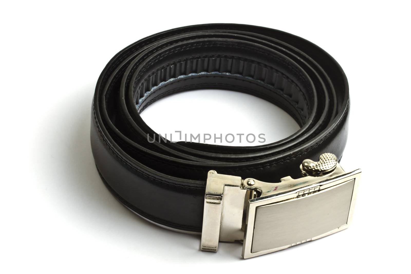 Black leather belt isolated on white by ibphoto