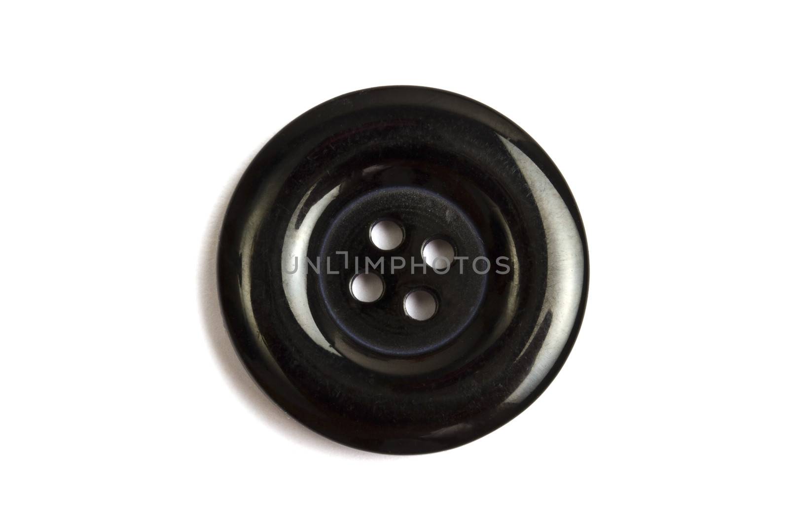  Black clothing button isolated on white background 