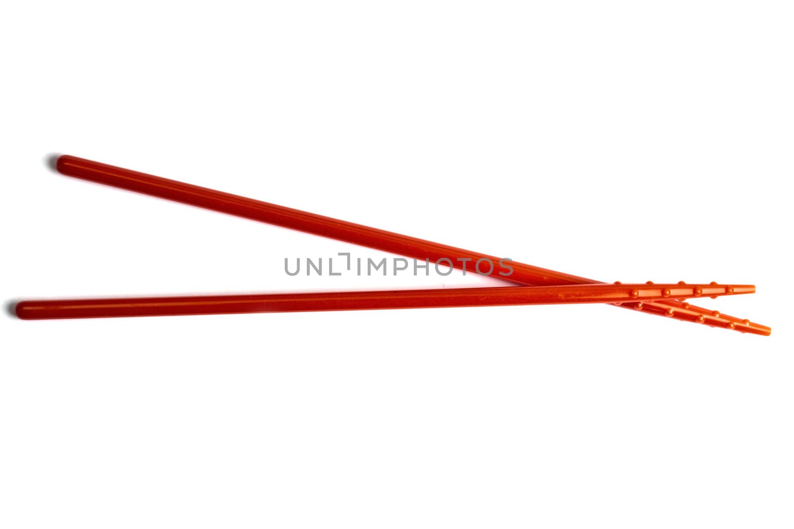 Red chopsticks isolated on white background 