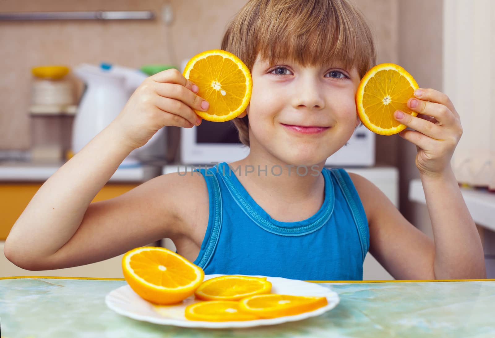 boy, breakfast, eats orange