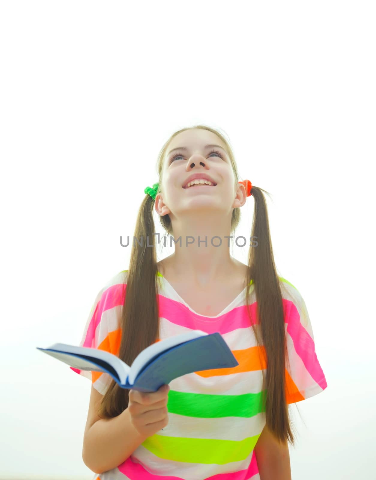 Teenage girl staying with a book