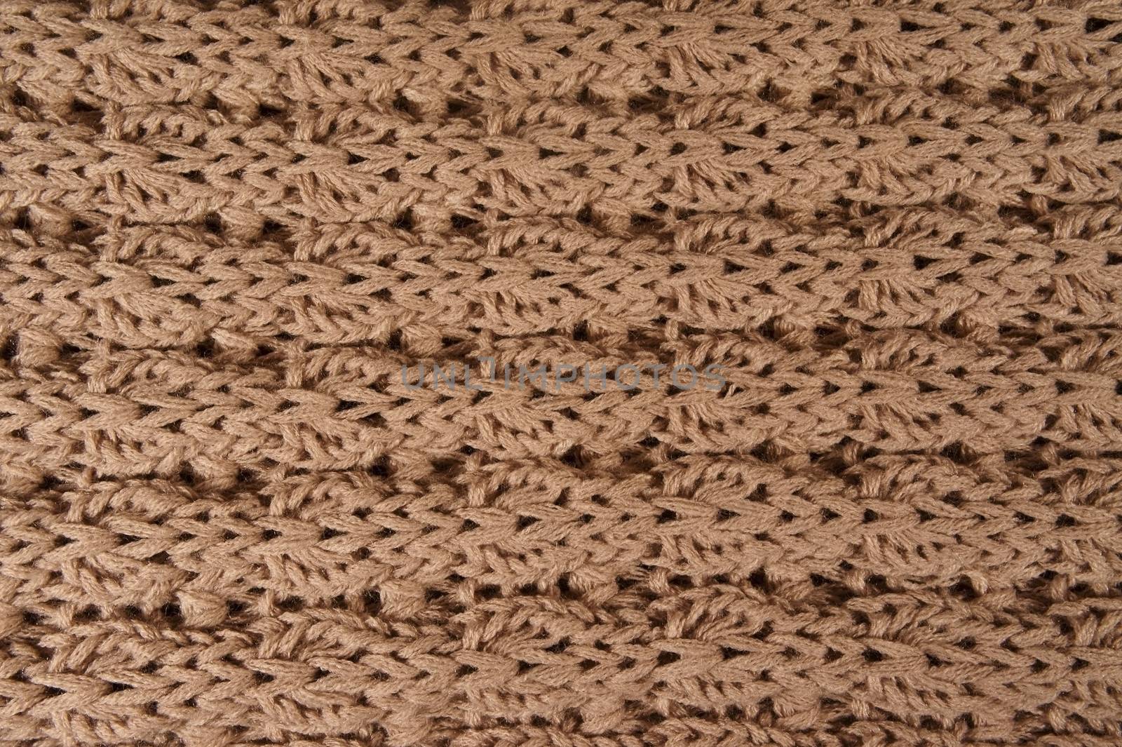 background of beige knitted woolen threads                 