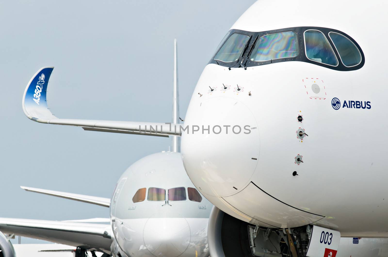 SINGAPORE - FEBRUARY 11: Airbus A350 XWB prototype 003 with Boeing 787 Dreamliner in the background at Singapore Airshow, Changi Exhibition Centre in Singapore on February 11, 2014.