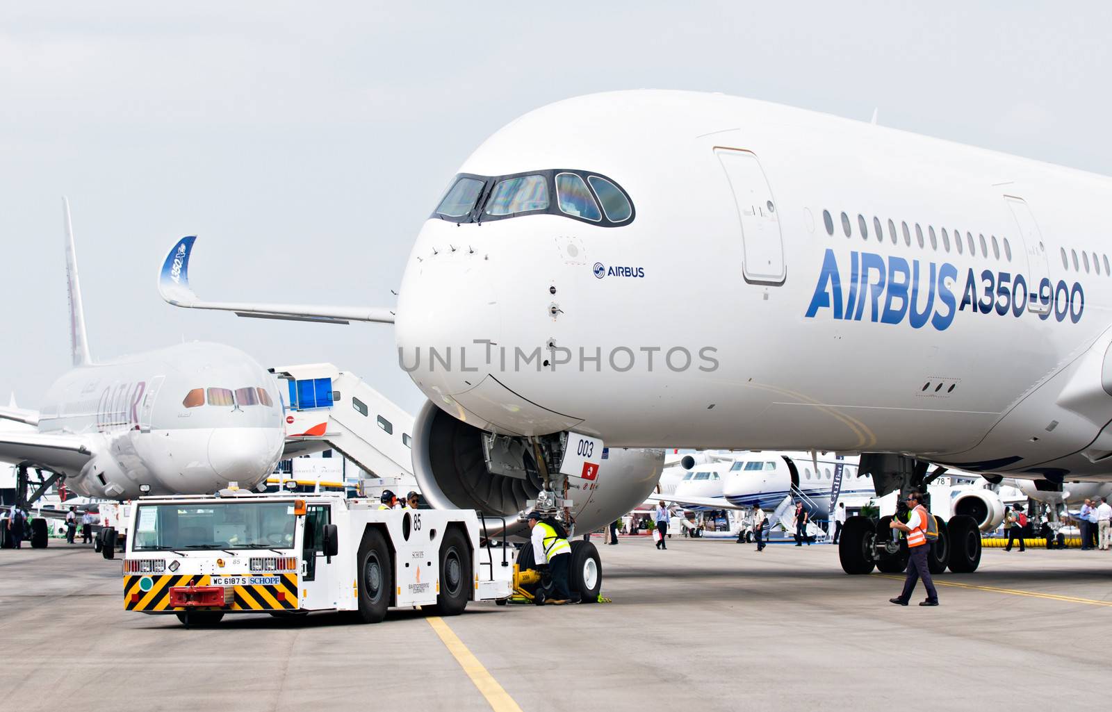 SINGAPORE - FEBRUARY 11: Airbus A350 XWB prototype 003 with Boeing 787 Dreamliner in the background at Singapore Airshow, Changi Exhibition Centre in Singapore on February 11, 2014.