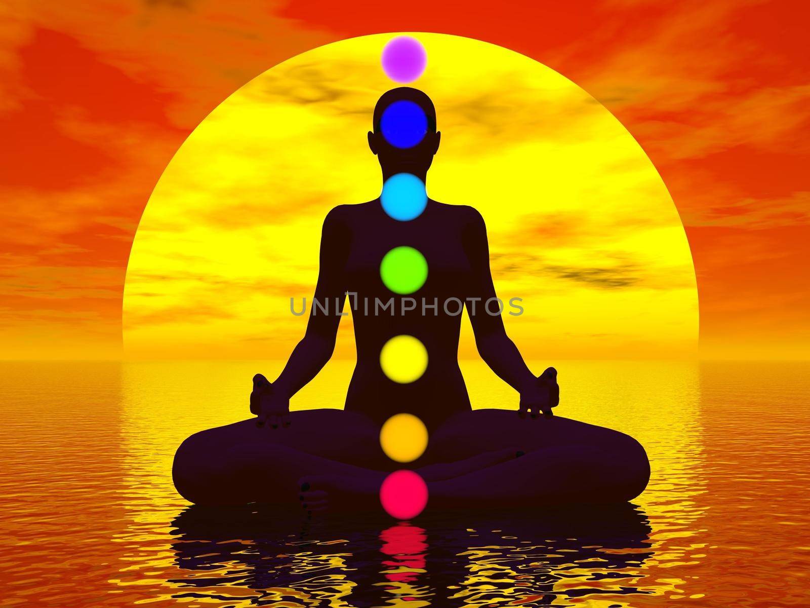 Silhouette of a woman meditating with seven colorful chakras upon ocean by red sunset
