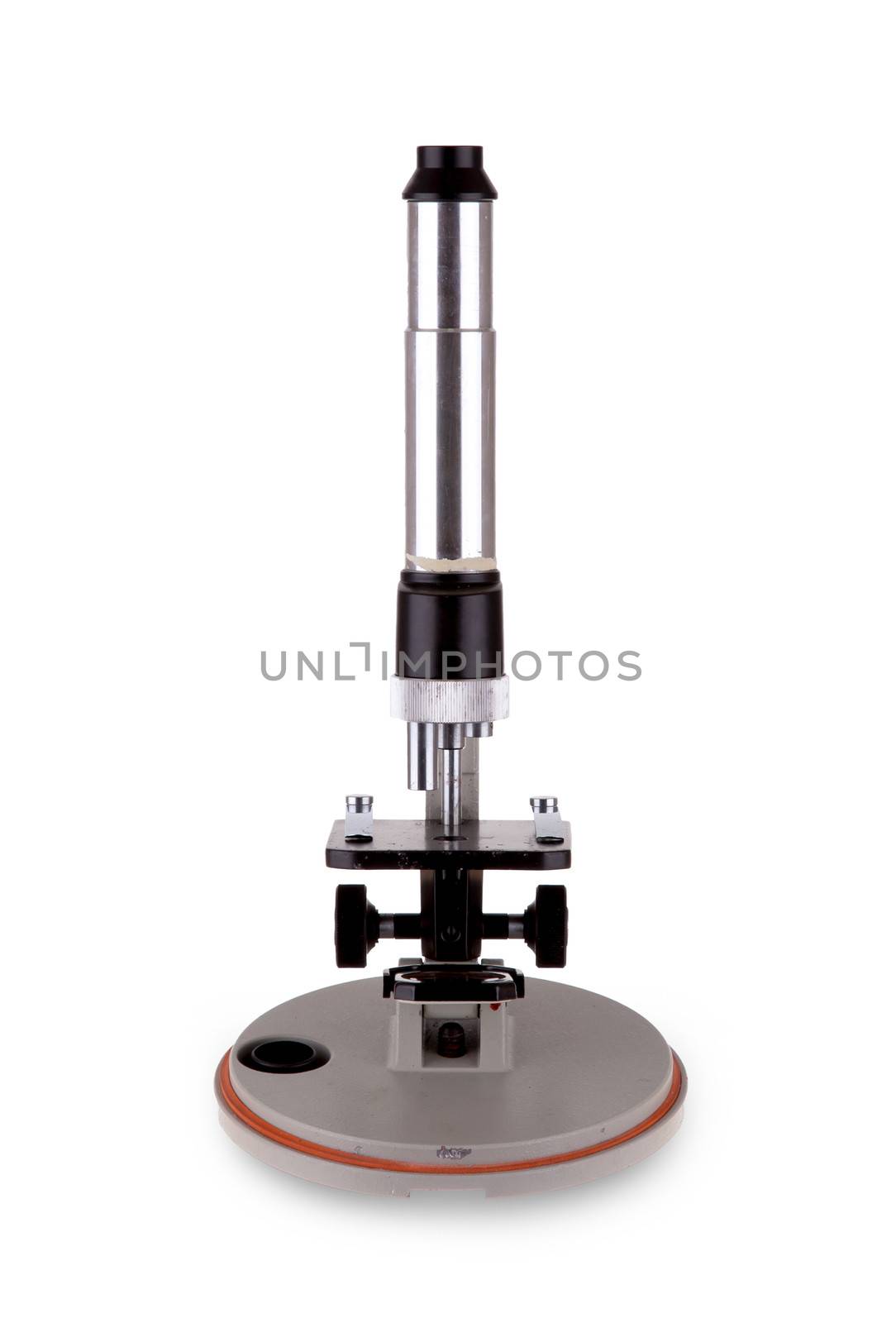 Old microscope isolated on a white background