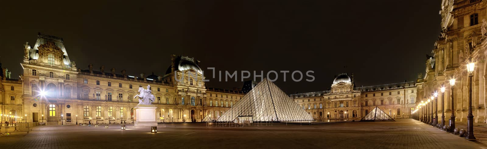 PARIS-APRIL 4: Panoramic view of Louvre Art Museum at night. The Louvre is the biggest Museum in Paris displayed over 60,000 square meters of exhibition space, on April 4, 2013 in Paris, France. by zhu_zhu