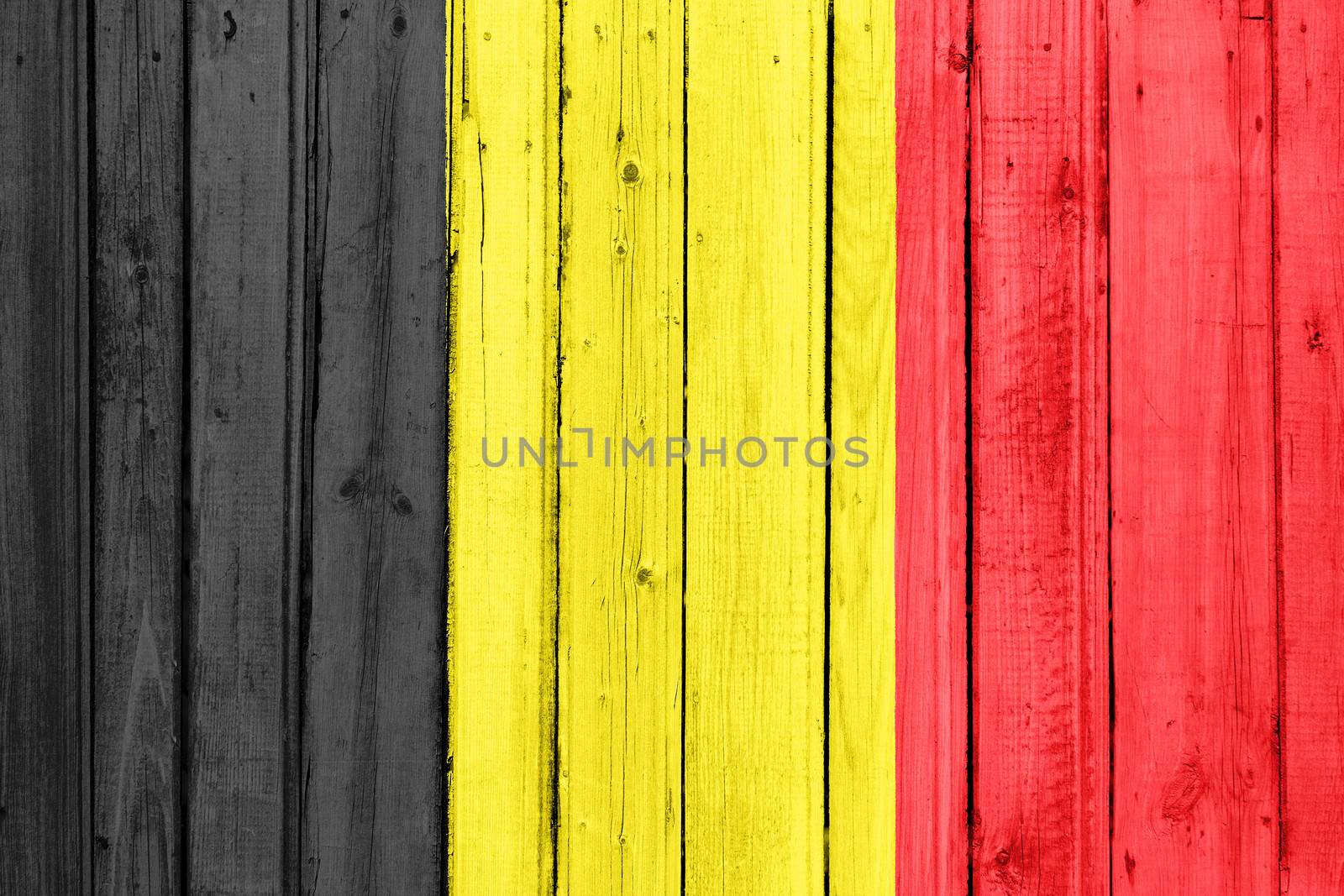 The Belgian flag painted on a wooden fence