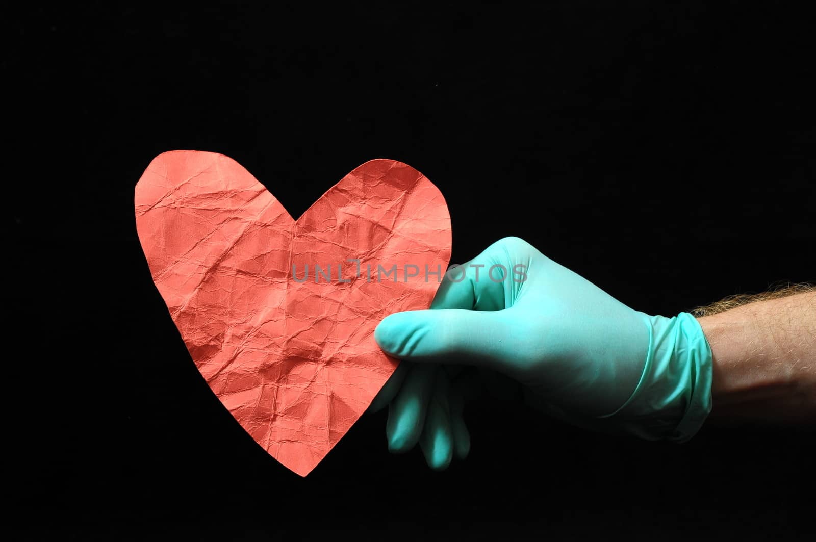 Heart And an Hand on a Black Background