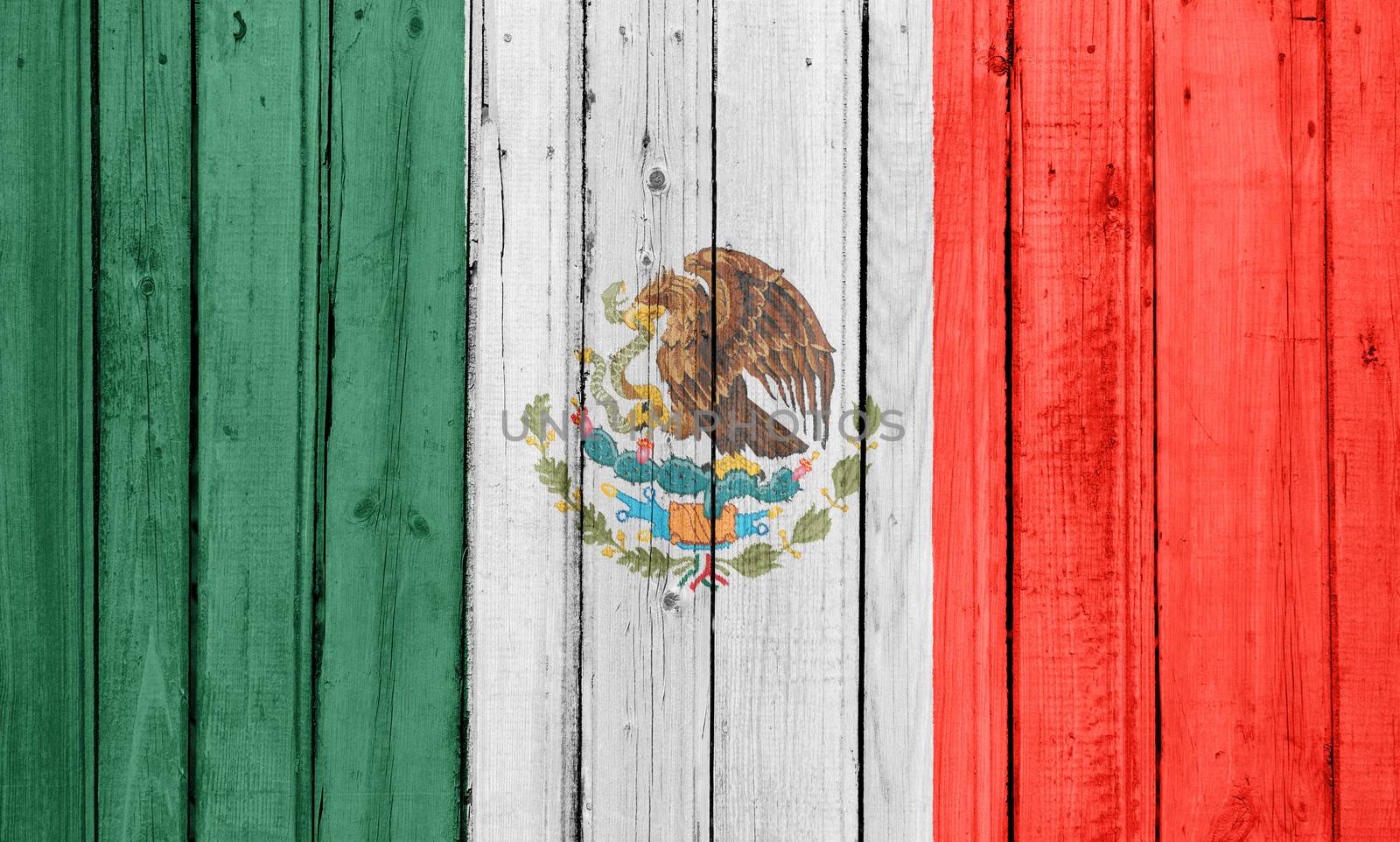 The Mexican flag painted on a wooden fence