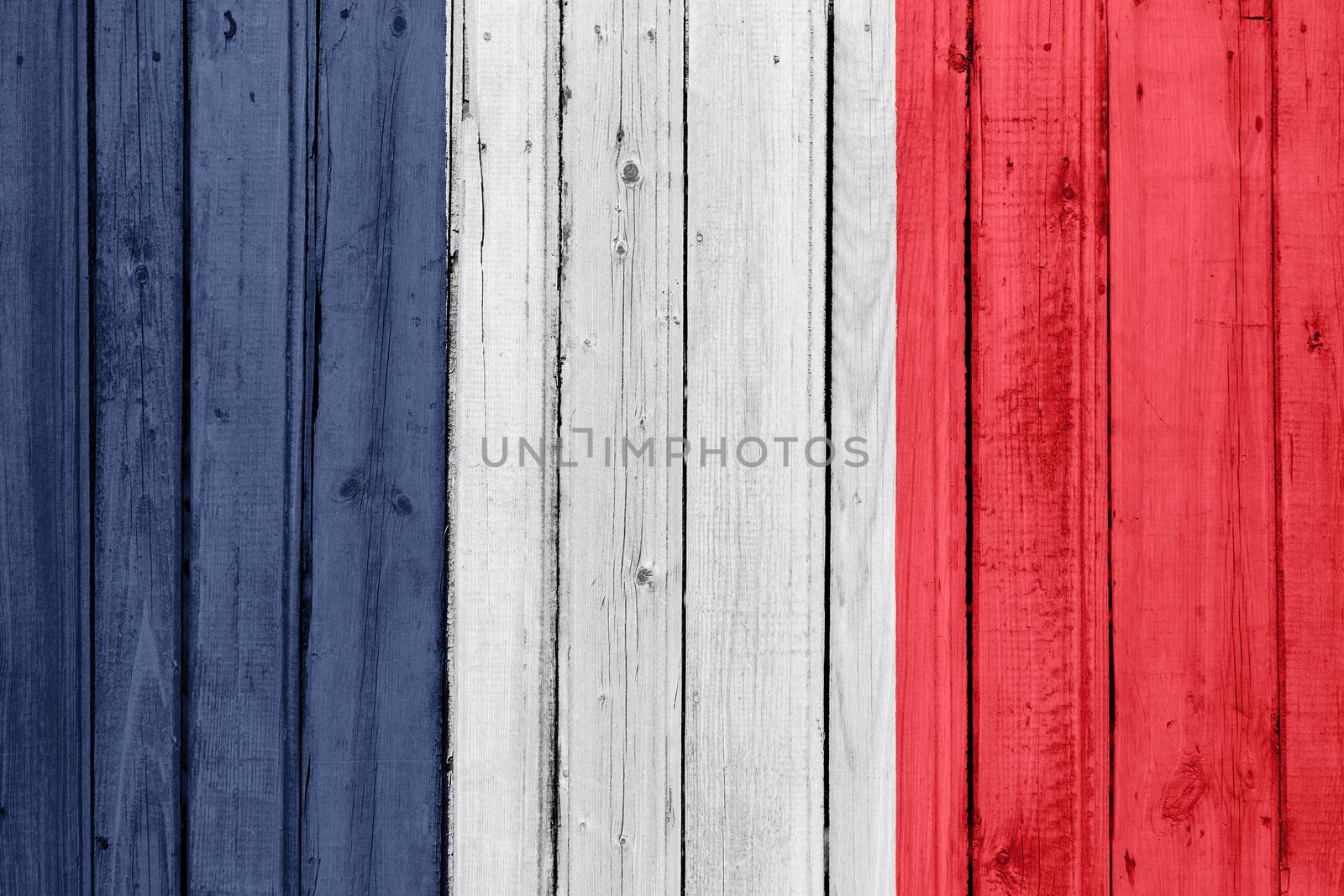 The French flag painted on a wooden fence