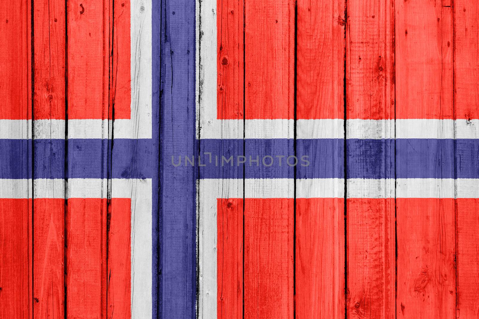 The Norwegian flag painted on a wooden fence