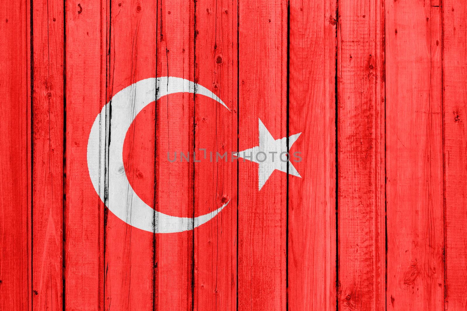 The Turkish flag painted on a wooden fence