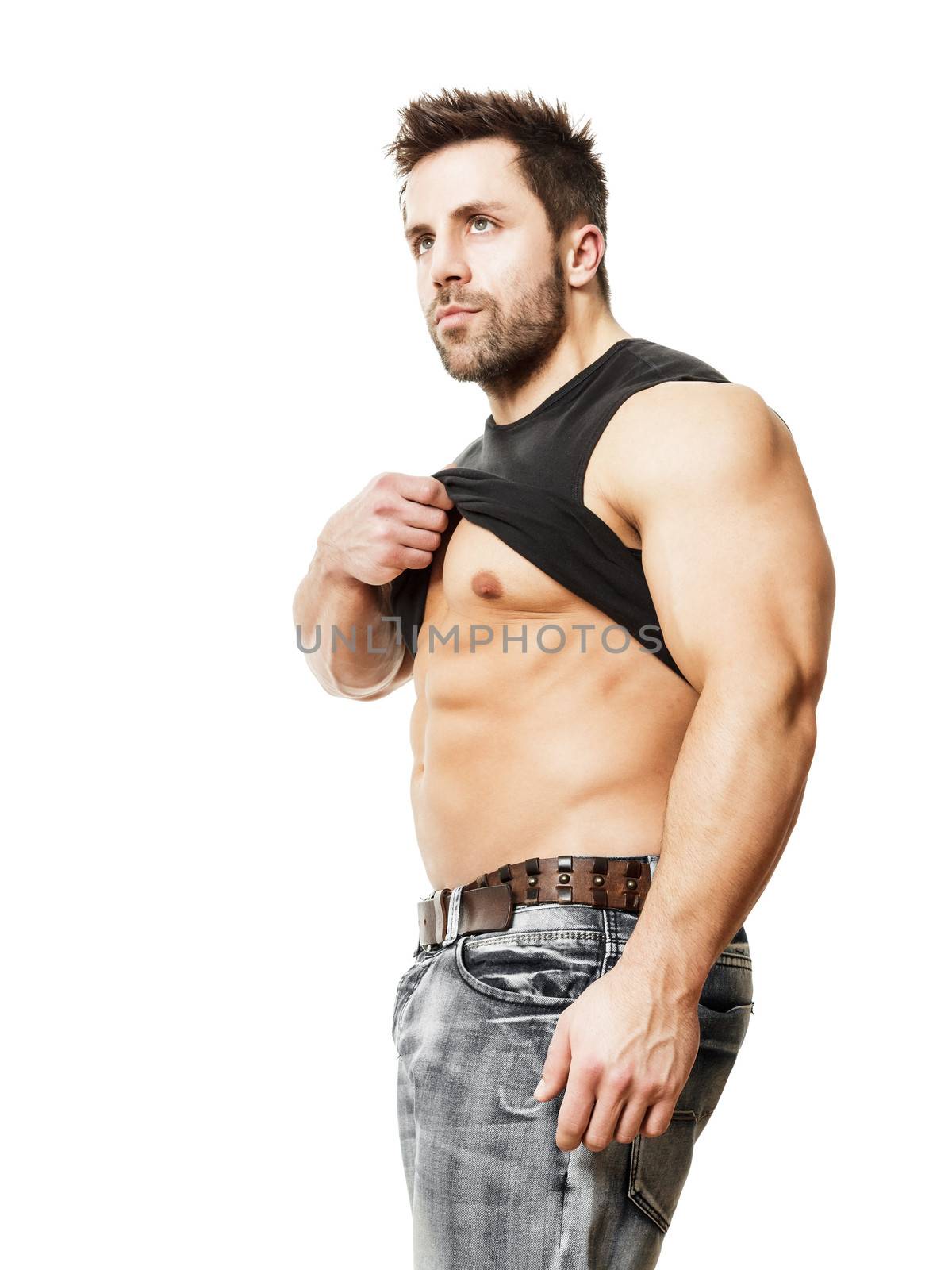 A handsome young muscular sports man his black shirt