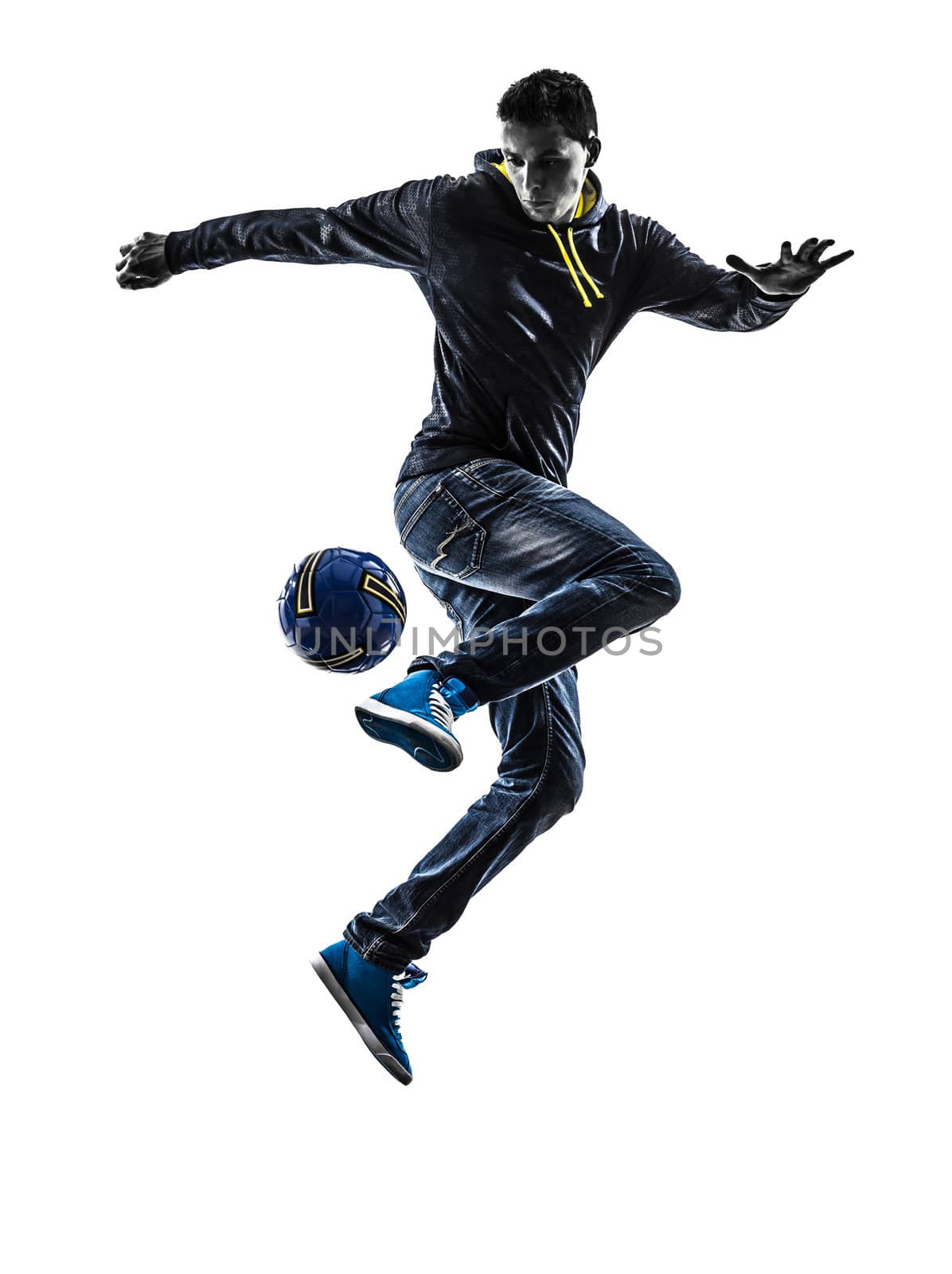 one caucasian young man soccer freestyler player in silhouette on white background