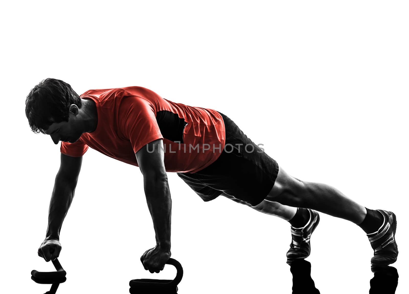 one man exercising fitness workout push ups in silhouette on white background