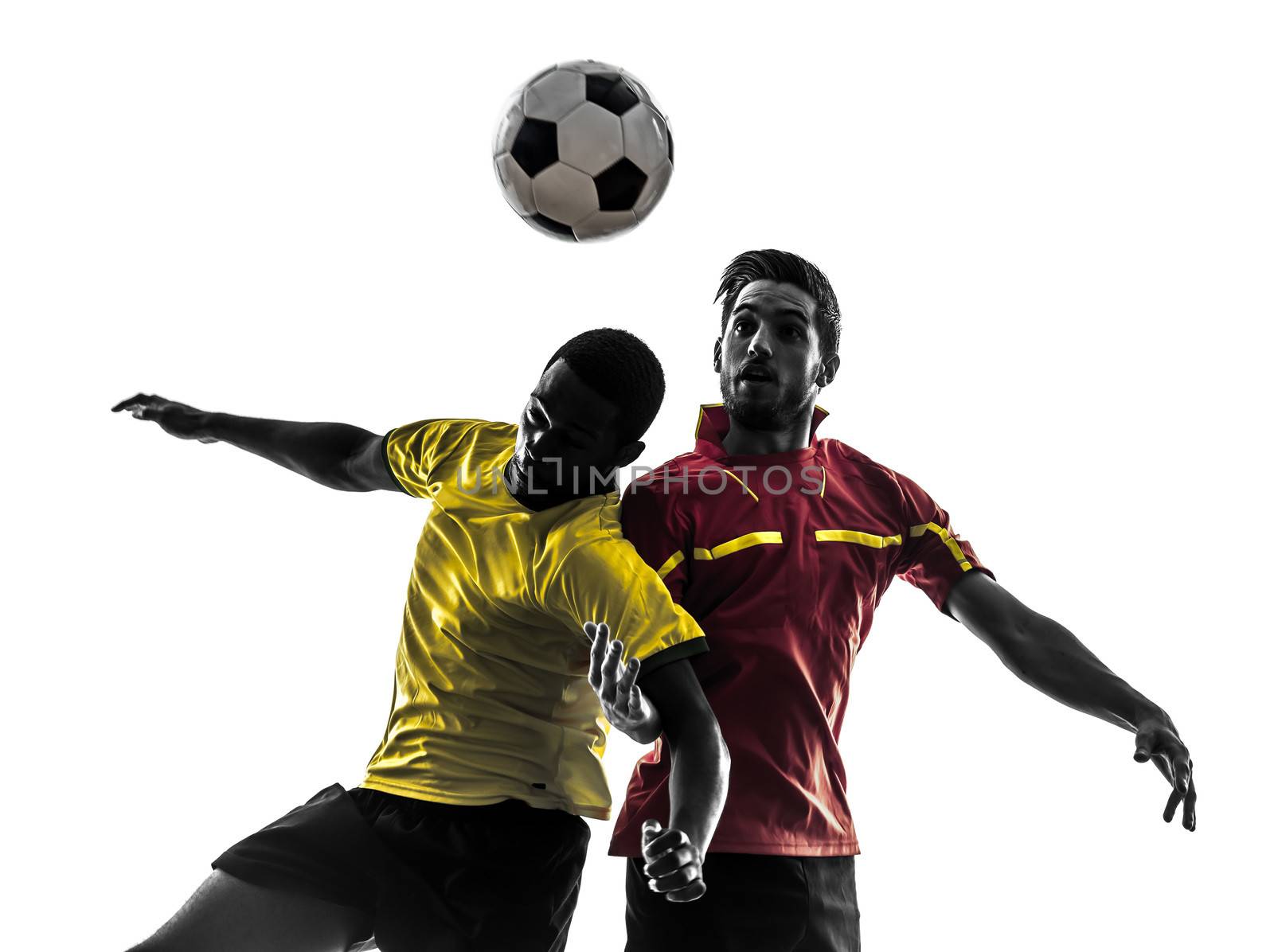 two men soccer player playing football competition fighting for a ball in silhouette on white background