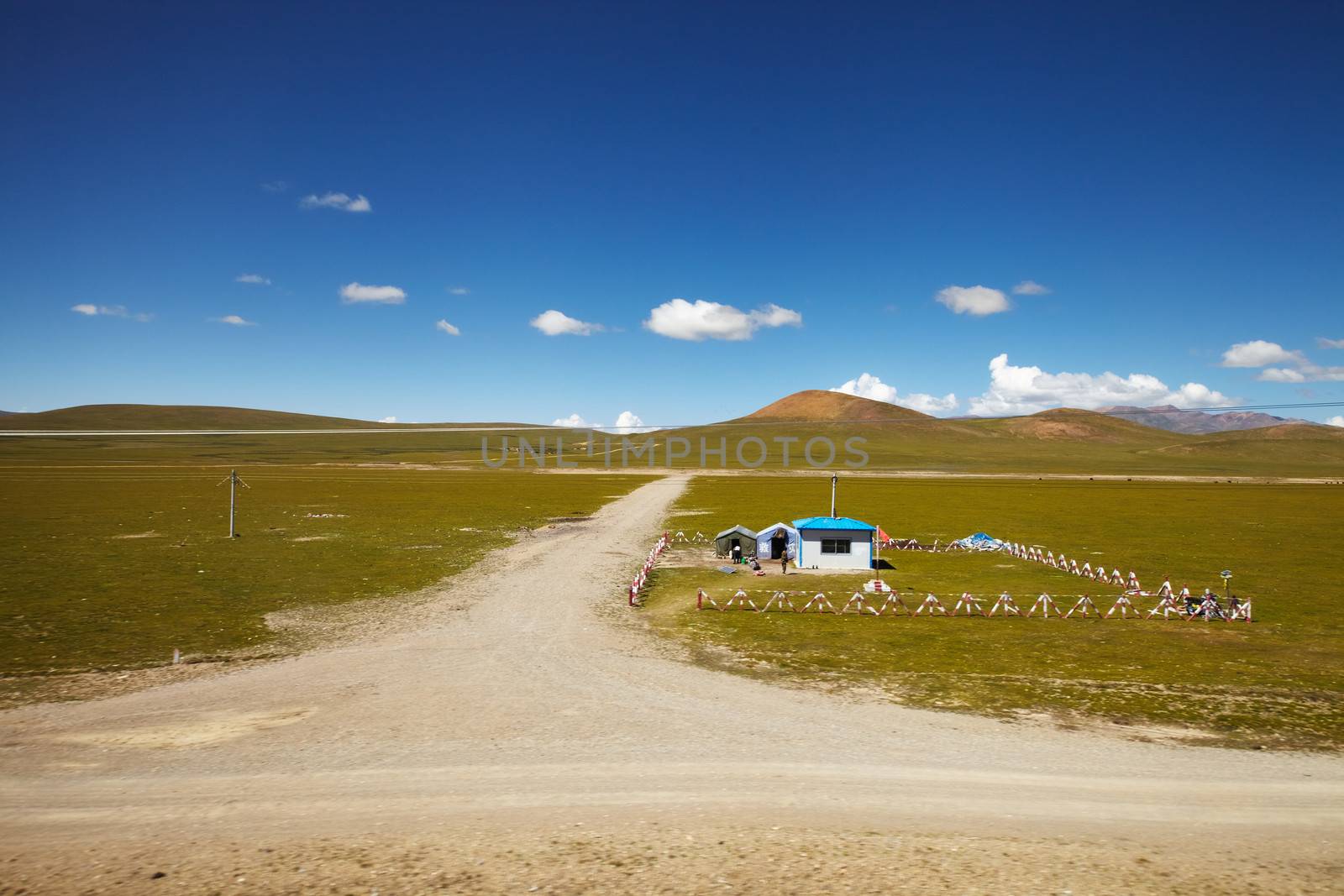 A chinese army outpost in Tibetan Plateau with mountain landscape in the background