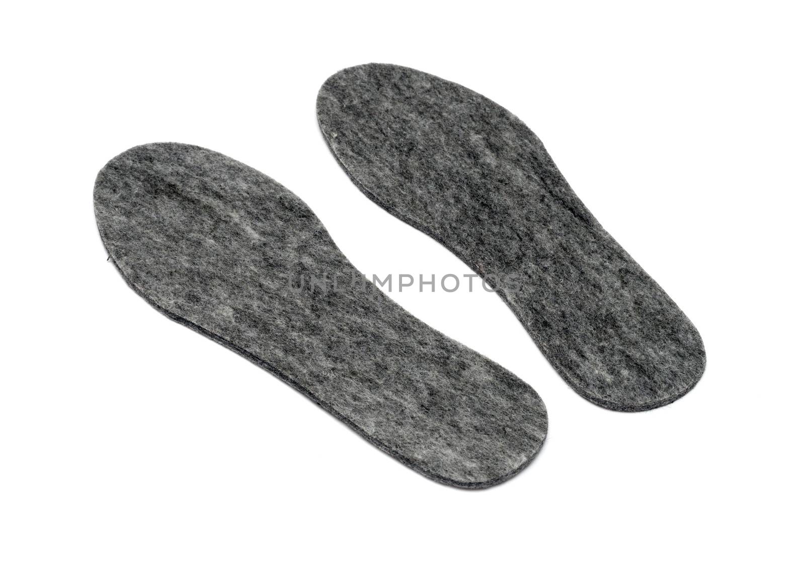 Felt insoles for shoes isolated on white background