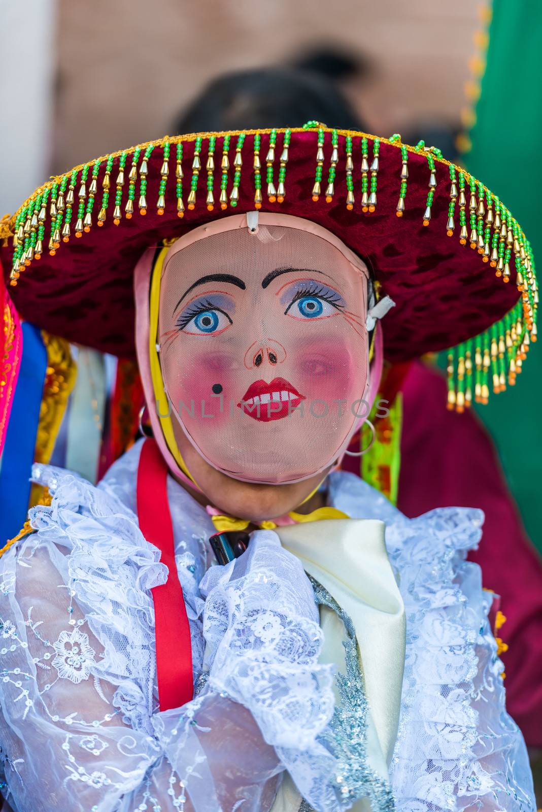 Pisac, Peru - July 16, 2013: masked woman at Virgen del Carmen parade in the peruvian Andes at Pisac Peru on july 16th, 2013