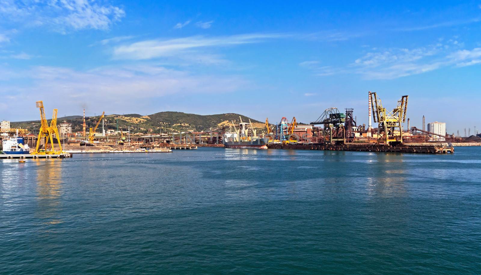 industrial port in Piombino from the sea, Tuscany, Italy