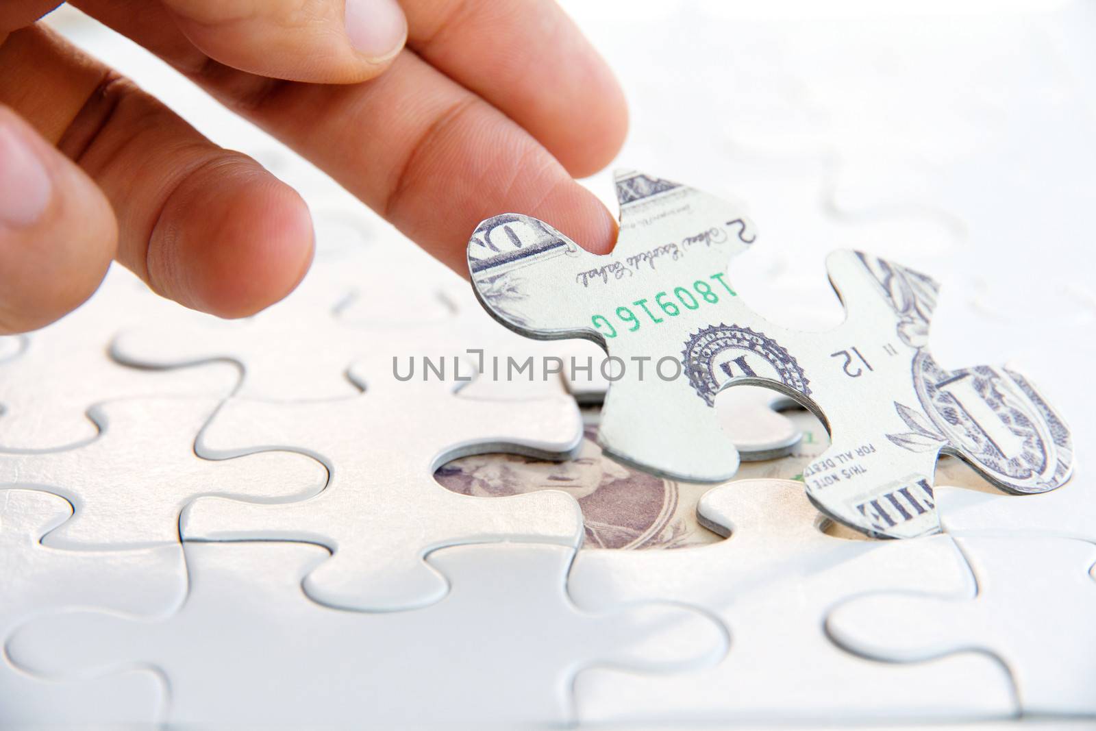 hand holding a puzzle piece, Finance concept