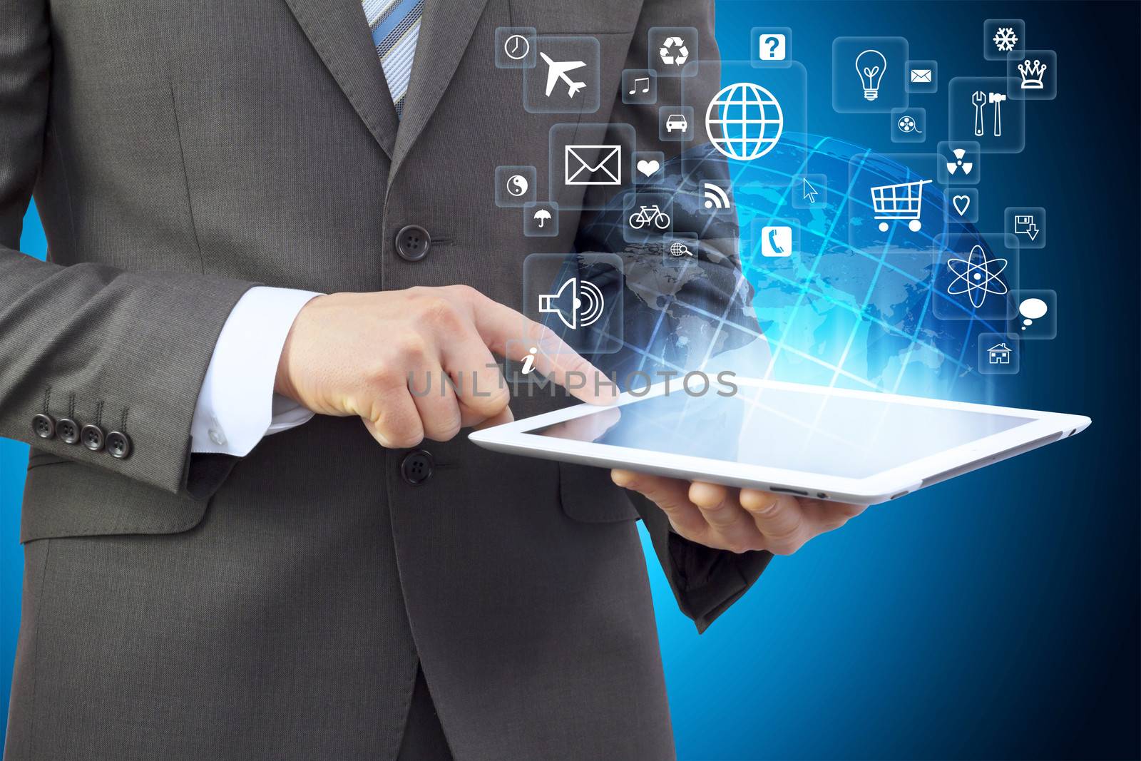 Businessman in a suit holding a tablet computer by cherezoff