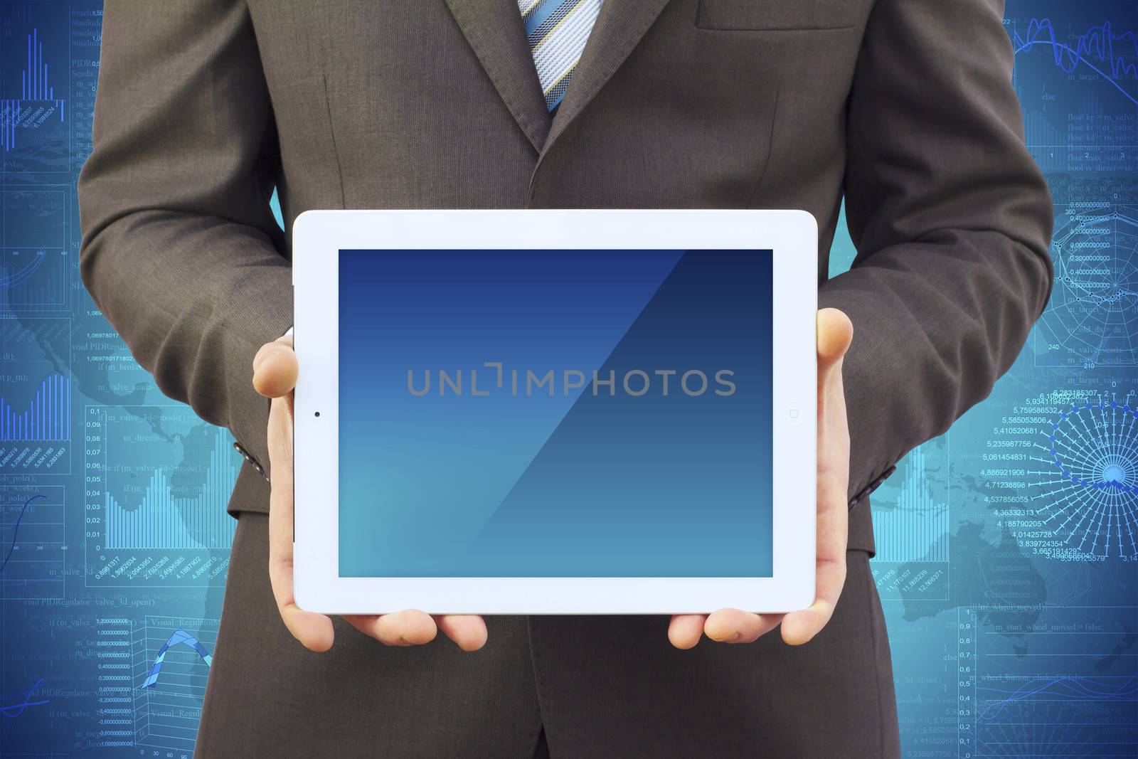 Businessman in a suit holding a tablet computer by cherezoff