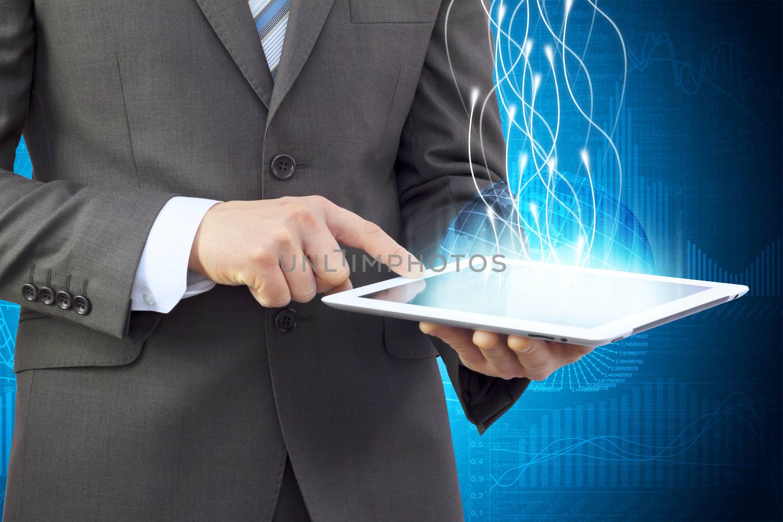 Businessman in a suit holding a tablet computer by cherezoff