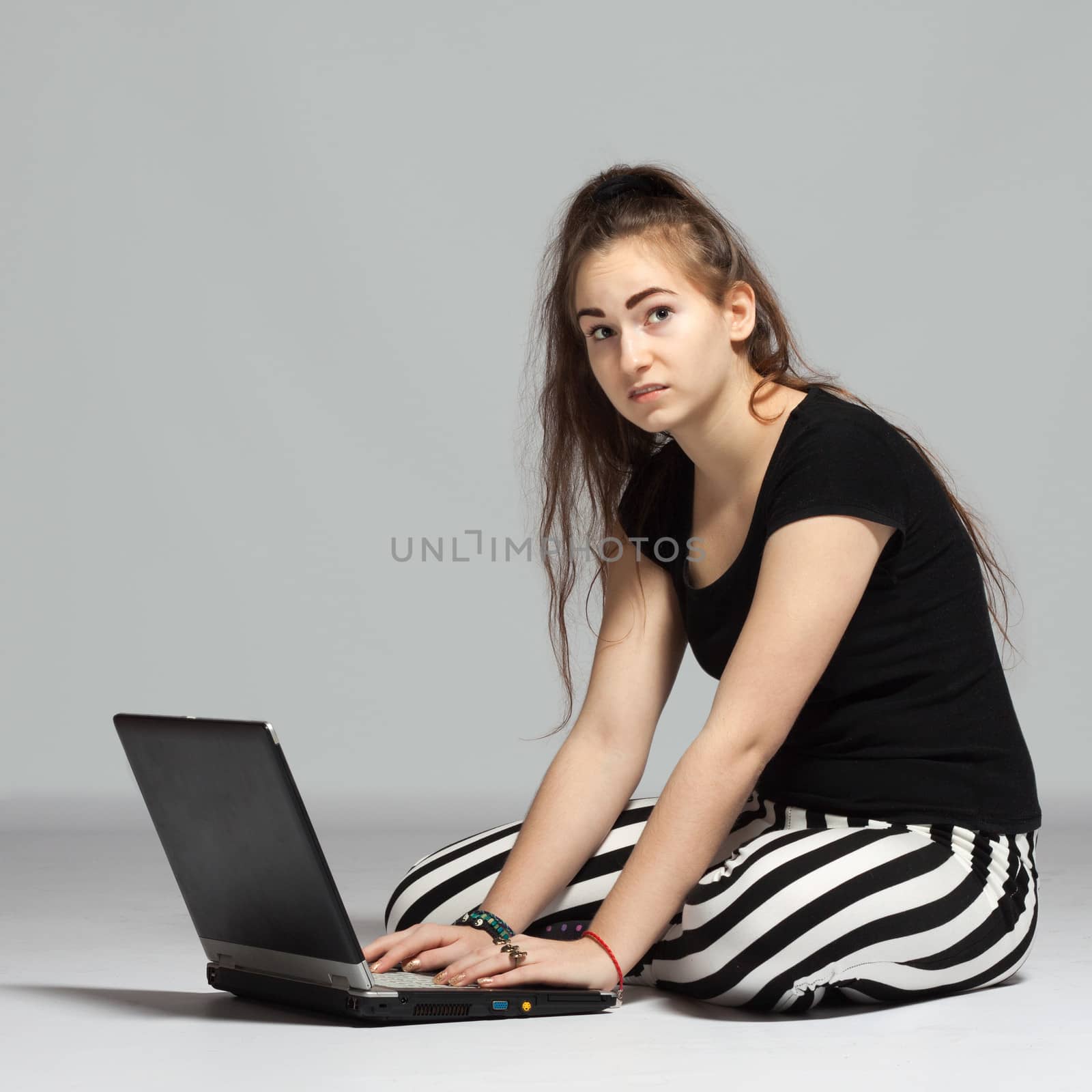 Teenager girl with laptop by maros_b