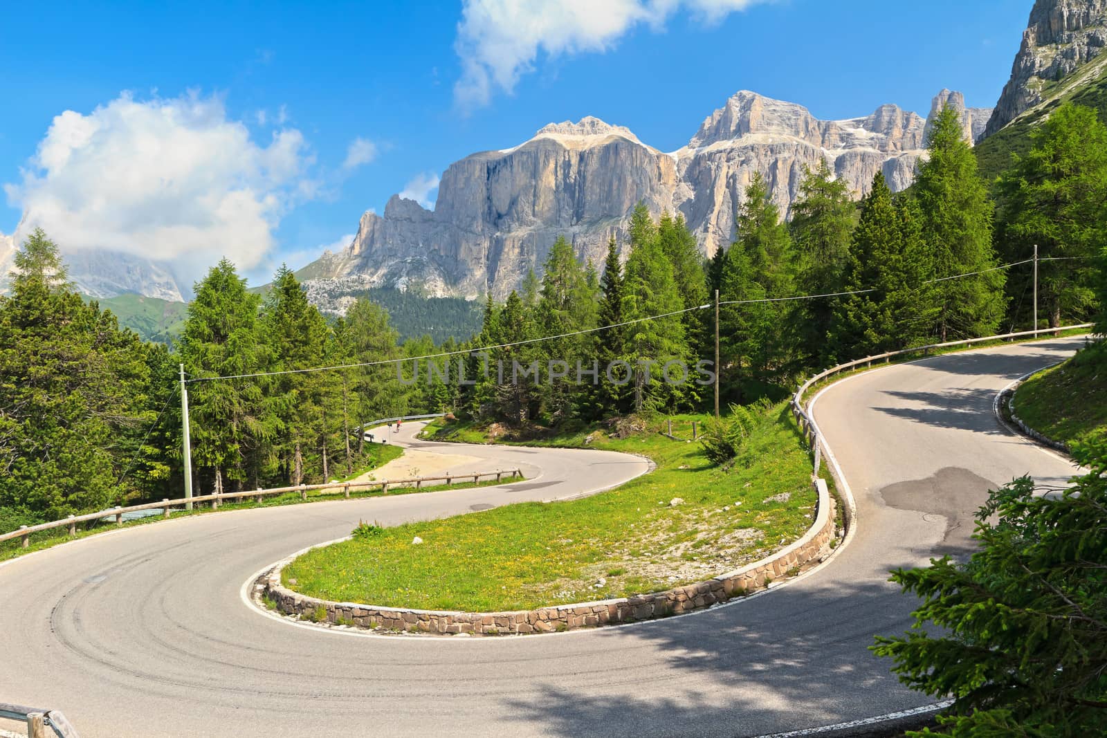 Dolomiti. winding road from Canazei to Pordoi pass, Trentino, Italy