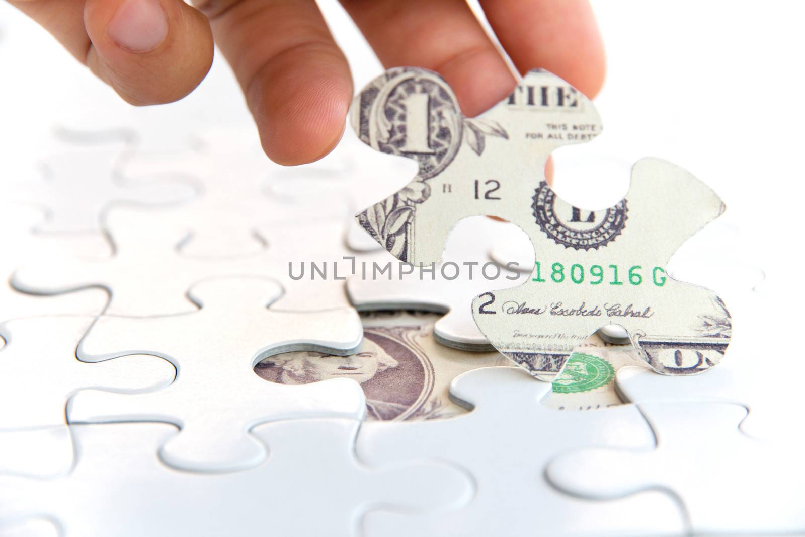 hand holding a puzzle piece, Finance concept