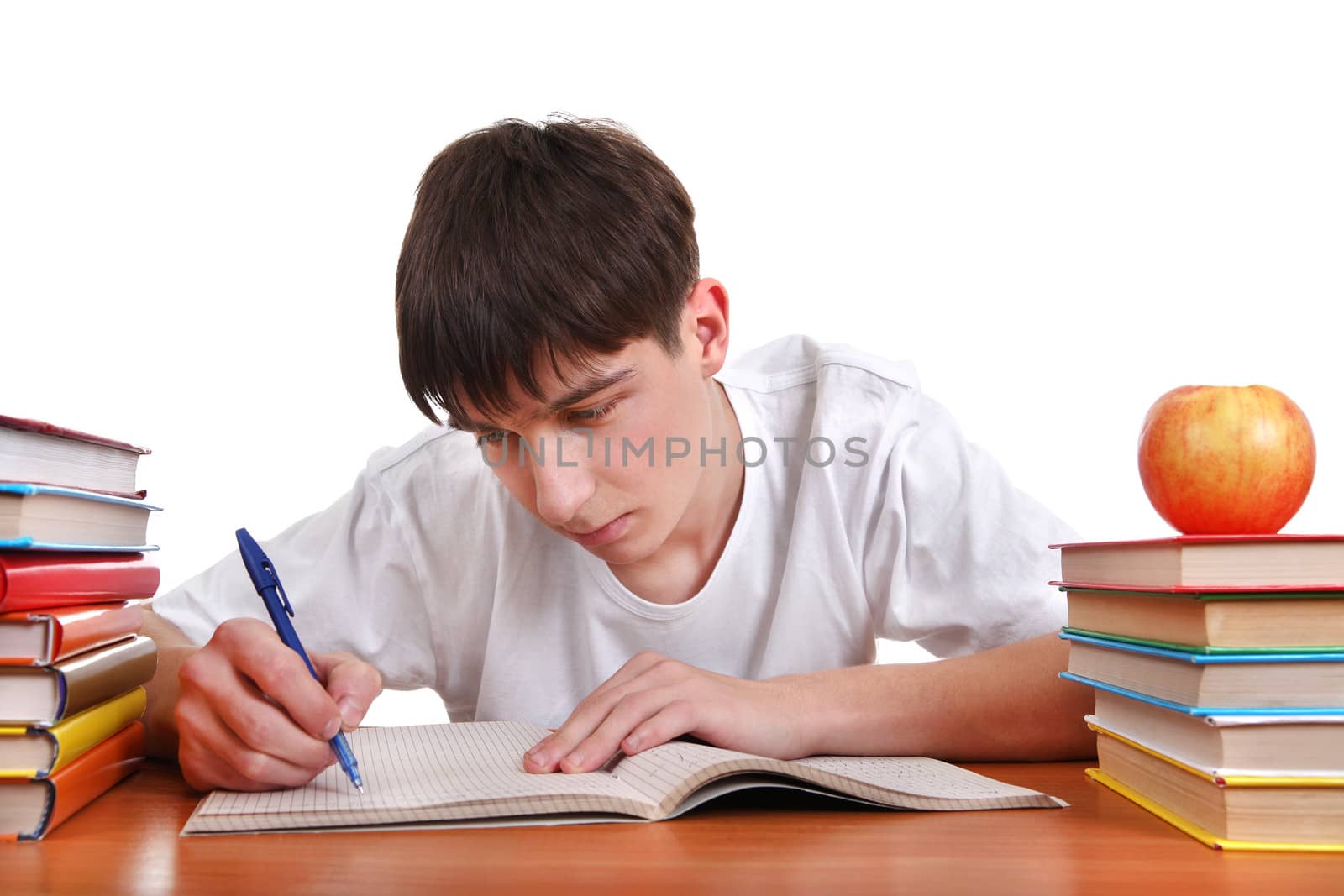 Student writing at the School Desk Isolated on the White Background