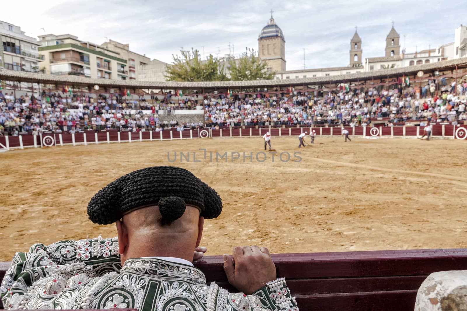 Ubeda, Jaen province, SPAIN - 2 october 2010: Detail of Bullfighter bald and slightly fat looking the bull during a bullfight held in Ubeda, Jaen province, Spain