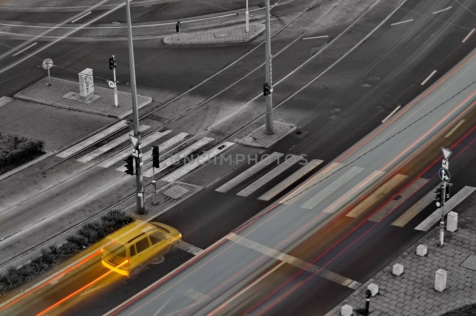 Yellow car stops at crossing