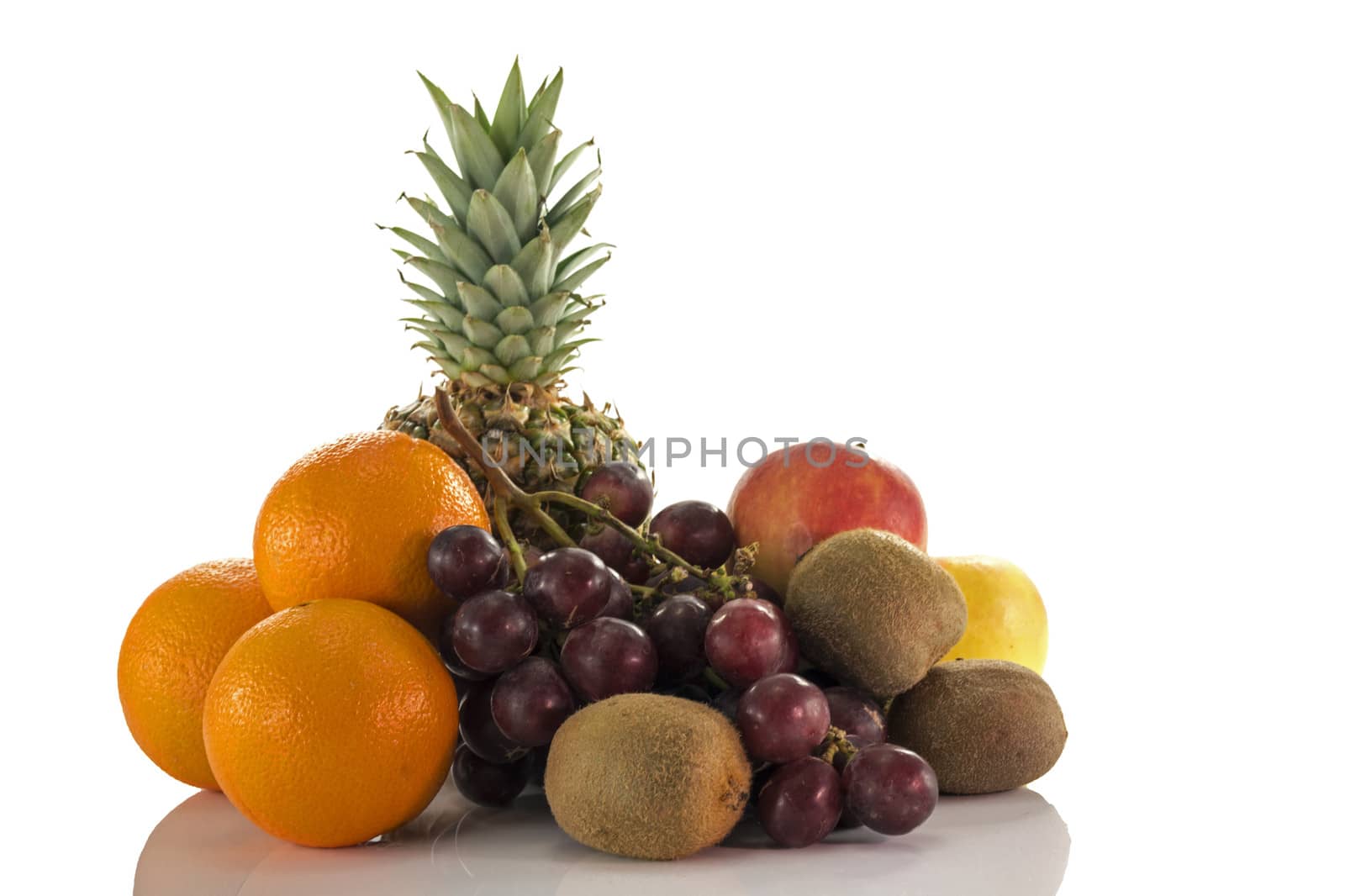 fruit as oranges pineapple grapes and kiwi isolated on white