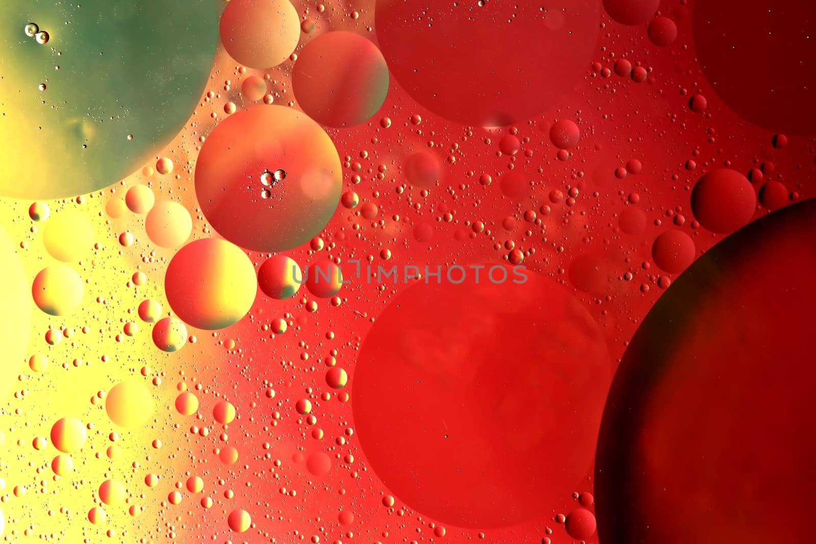Abstract pattern of colored oil bubles on water looking like space galaxy