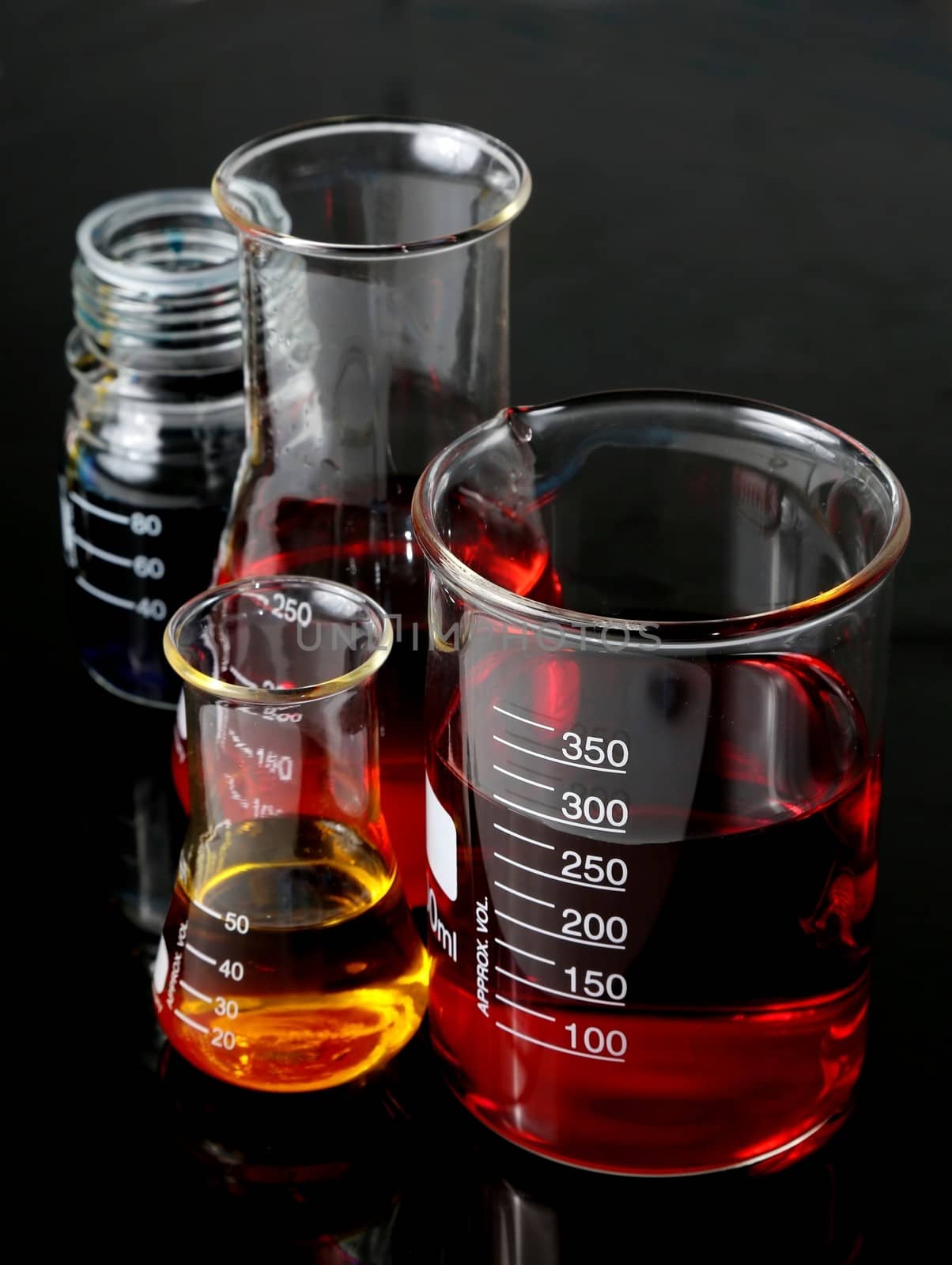 Laboratory Flasks Glassware with red, blue and yellow solutions