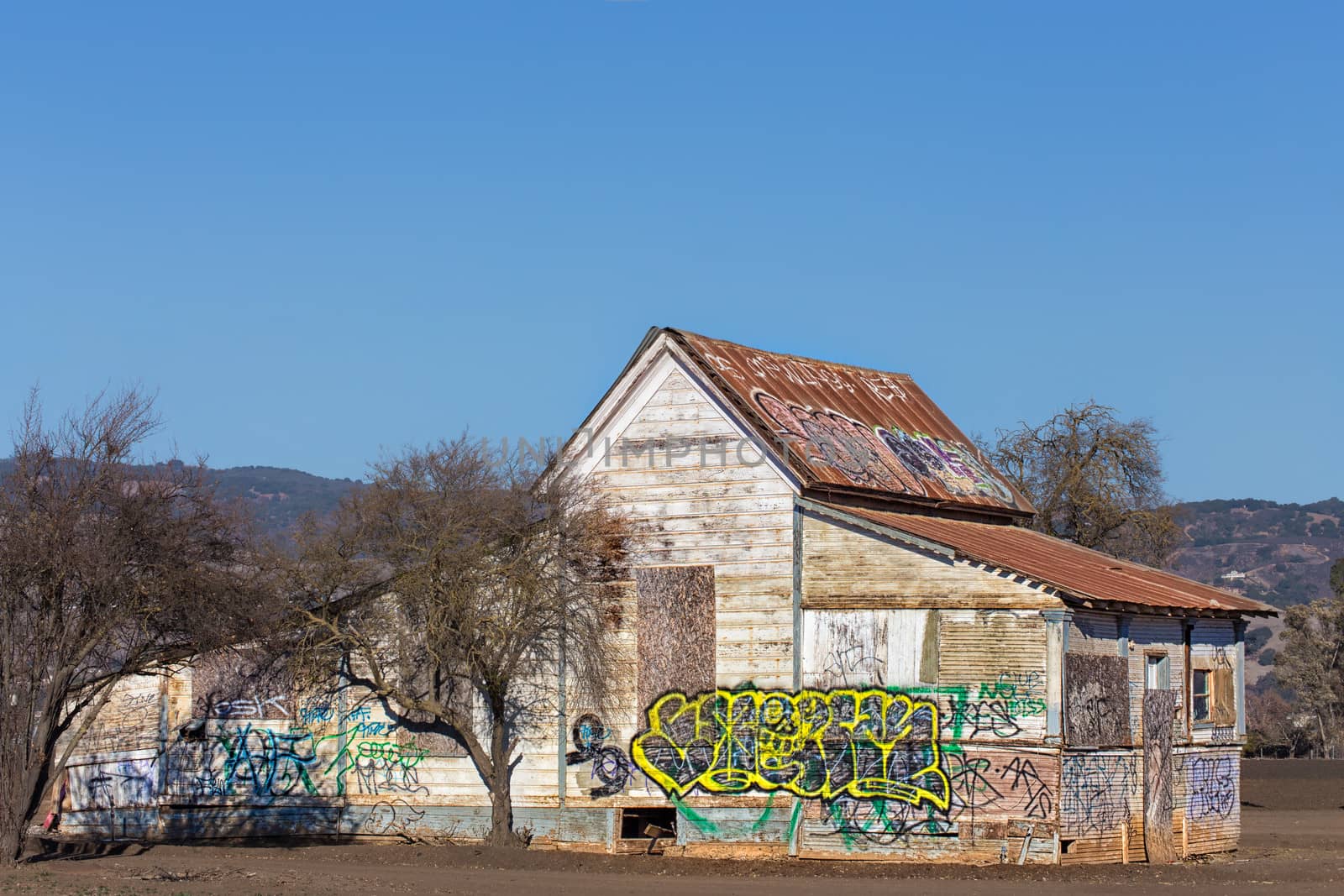 Dilapidated and Abandoned Farm House Marked with Graffiti in the United States.