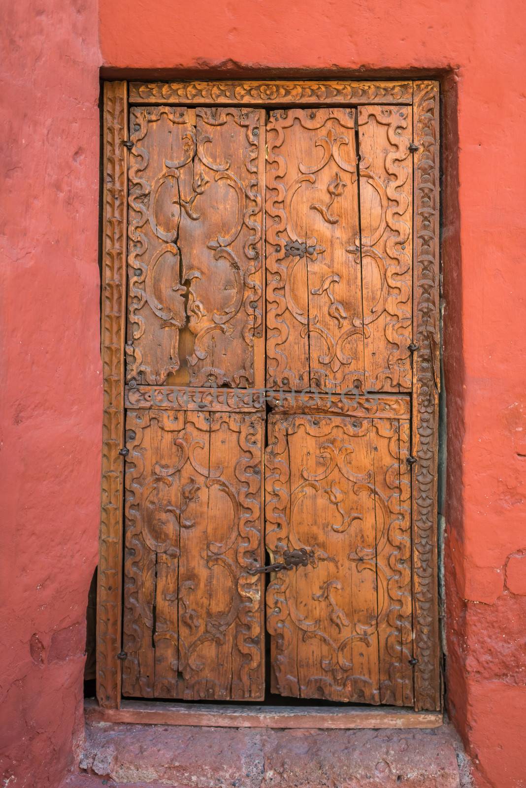 wooden door in Santa Catalina monastery in the peruvian Andes at Arequipa Peru