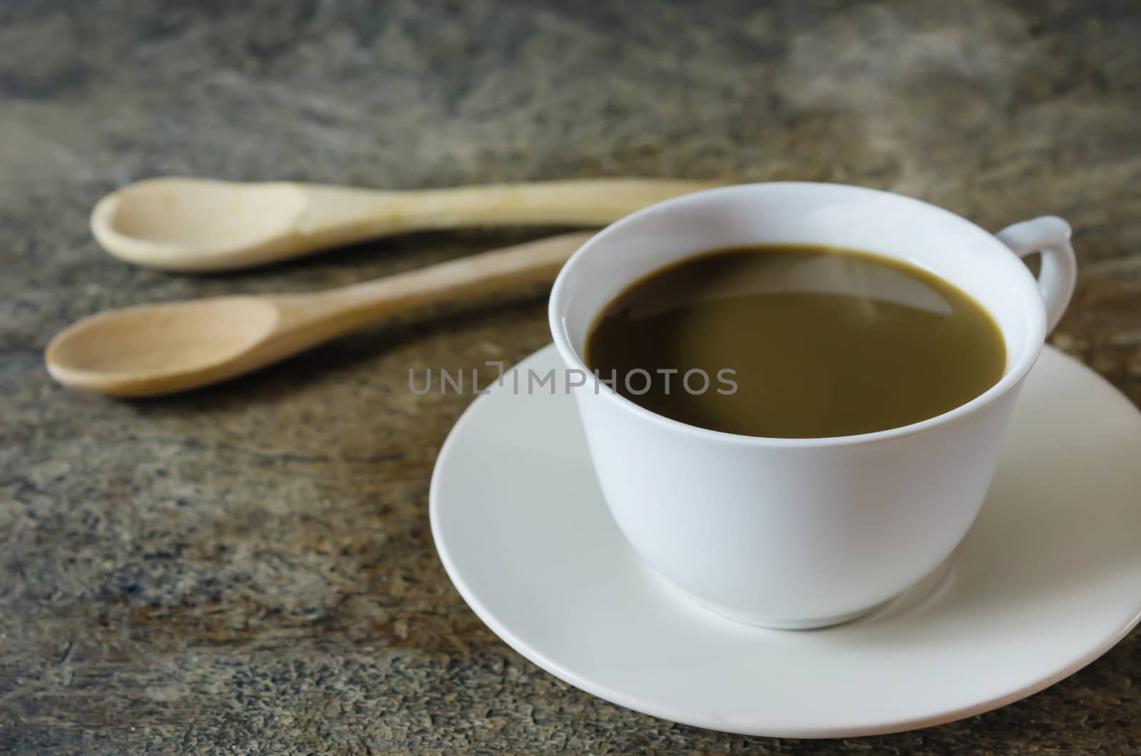 still life of coffee cup  with spoon  on a wooden table