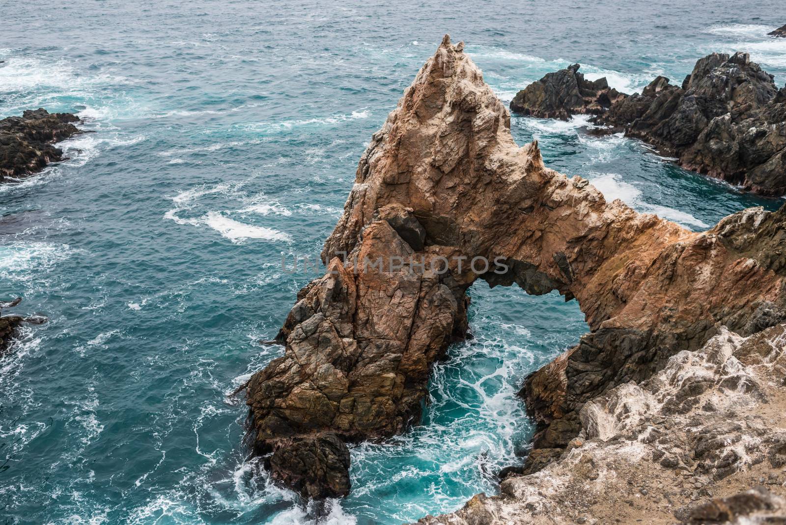 cliffs near the sea in the peruvian coast at puerto inca  Peru by PIXSTILL