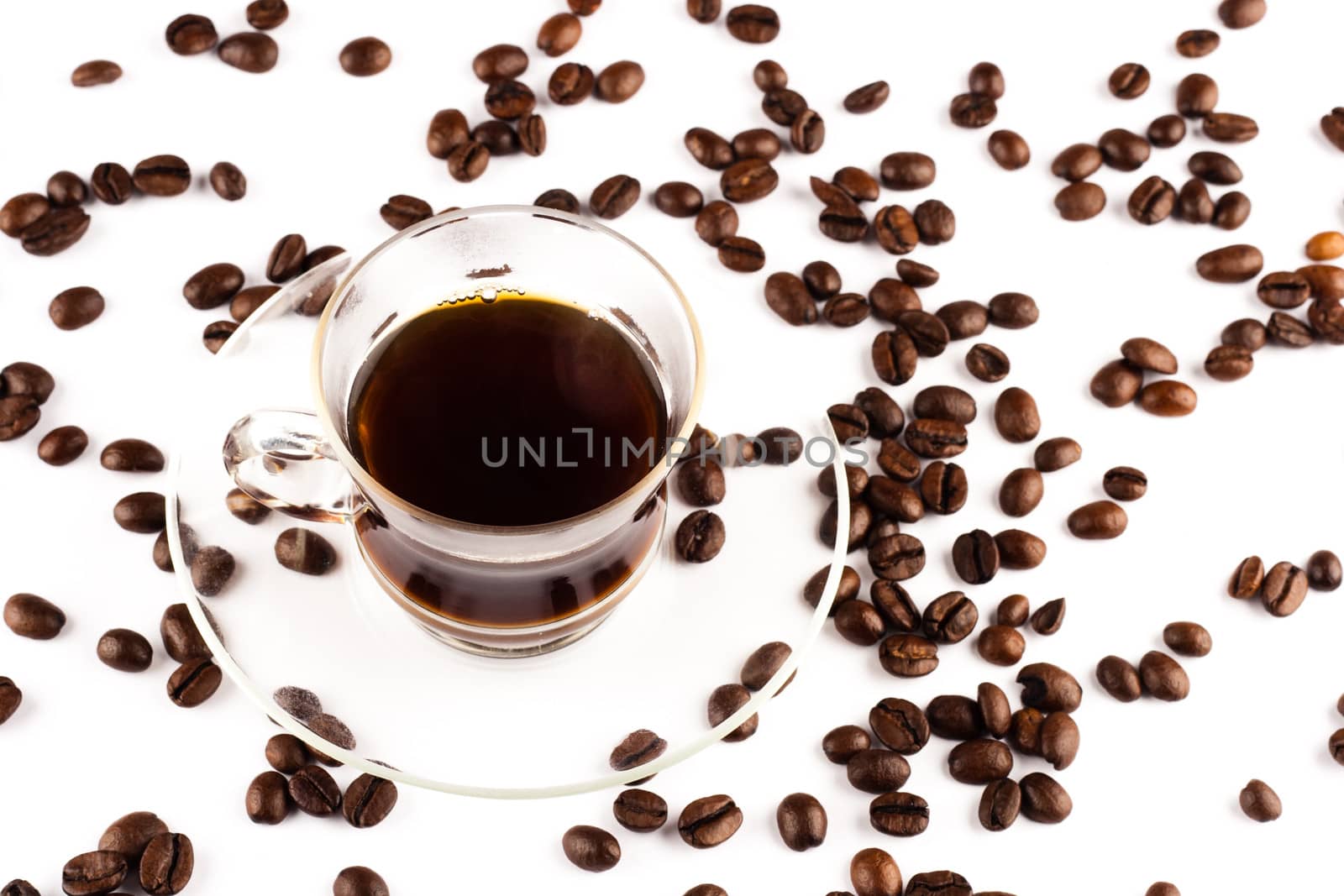 Coffee cup with coffee beans on white background.