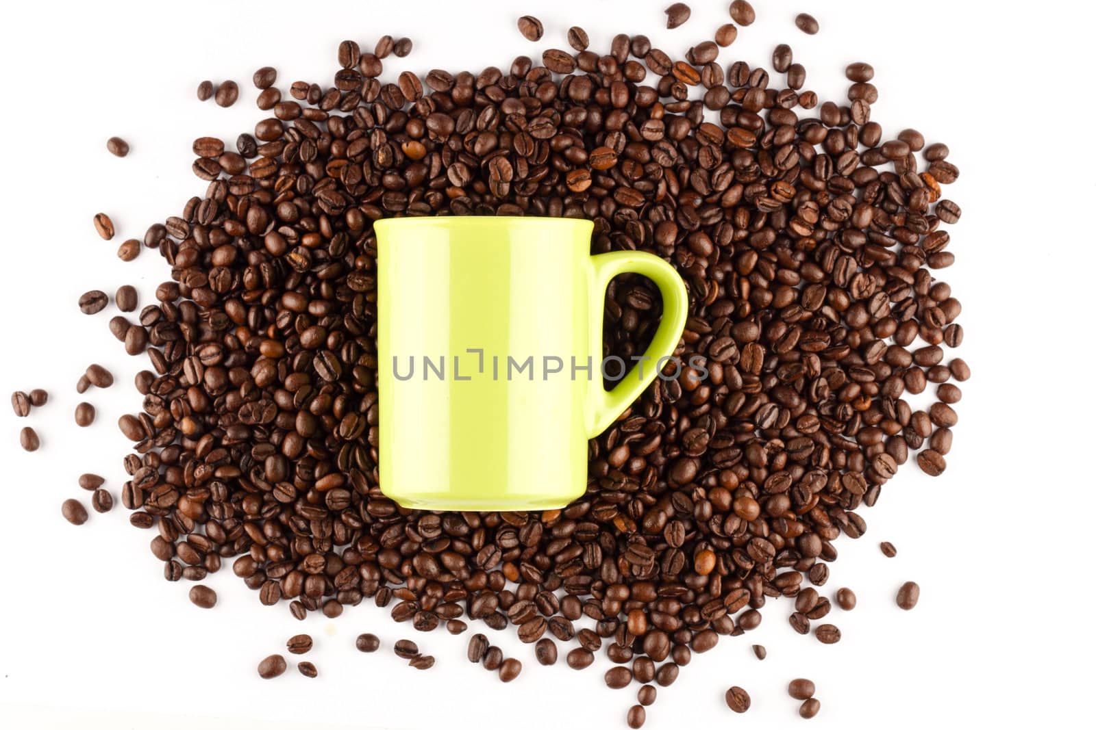 Coffee cup with coffee beans on white background.