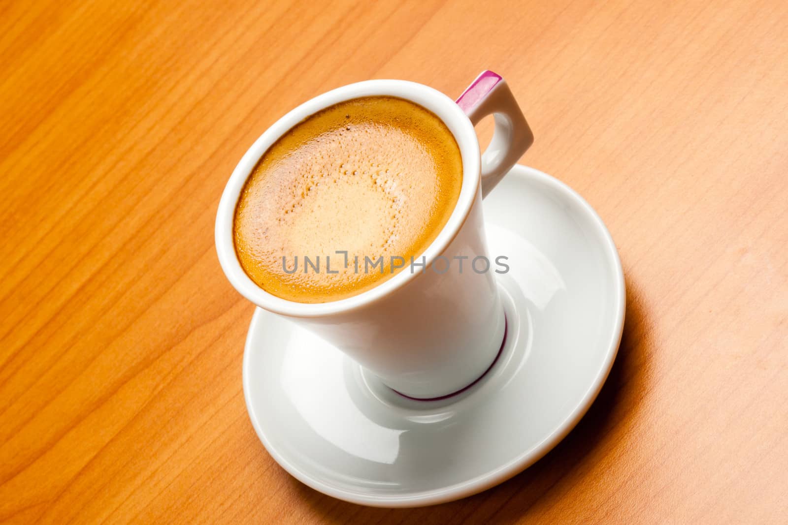 Cup of espresso coffe on table, shot from above