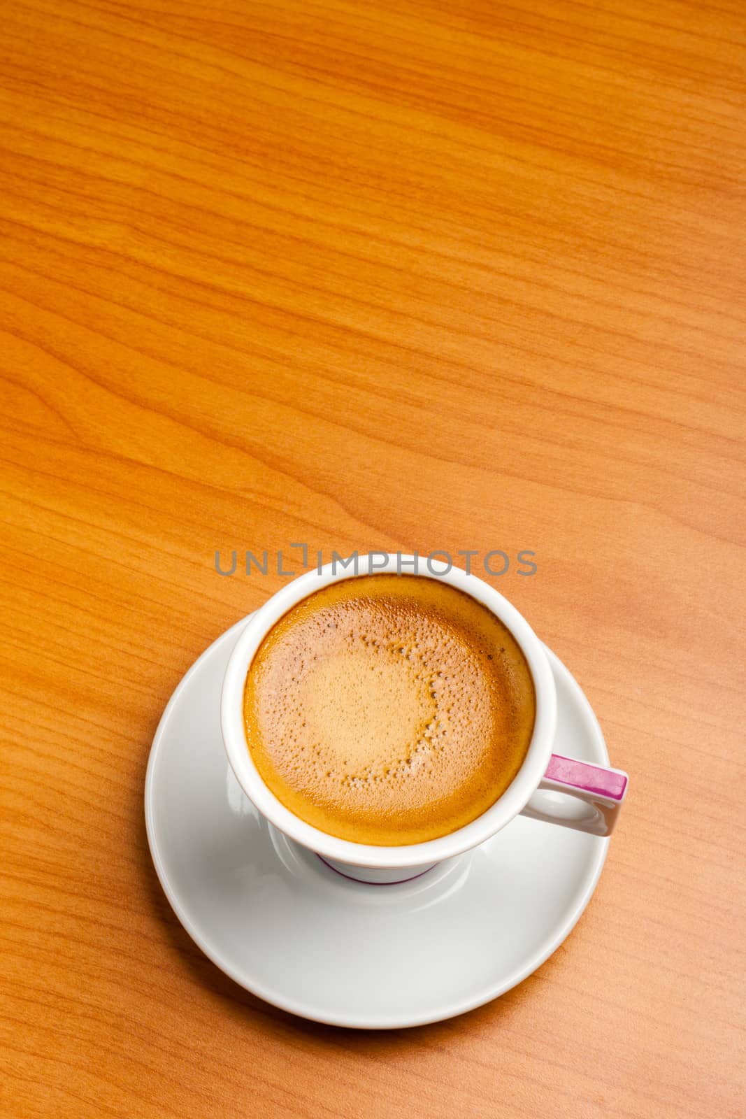 Cup of espresso coffe on table, shot from above