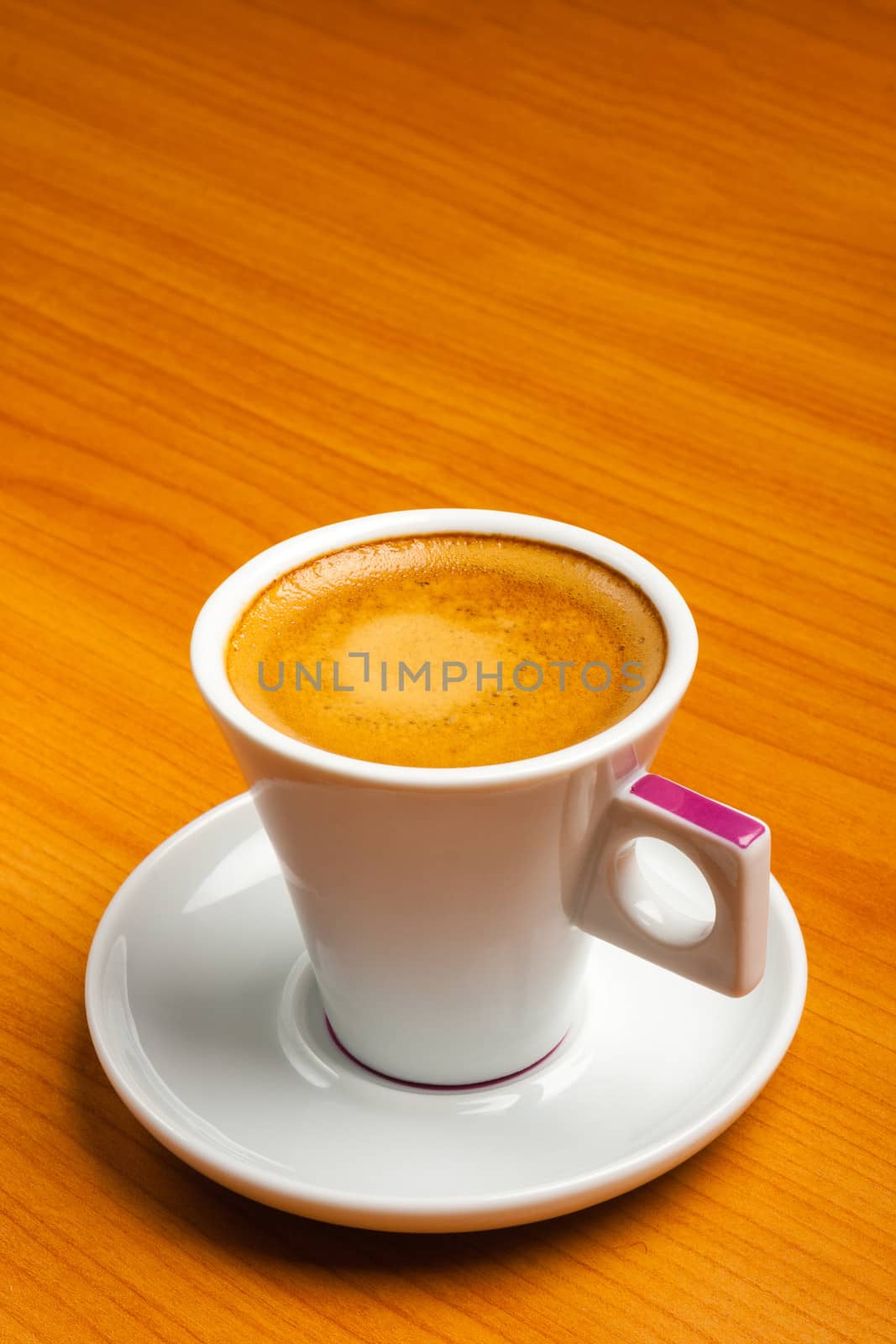 Cup of espresso coffe on table, shot from above