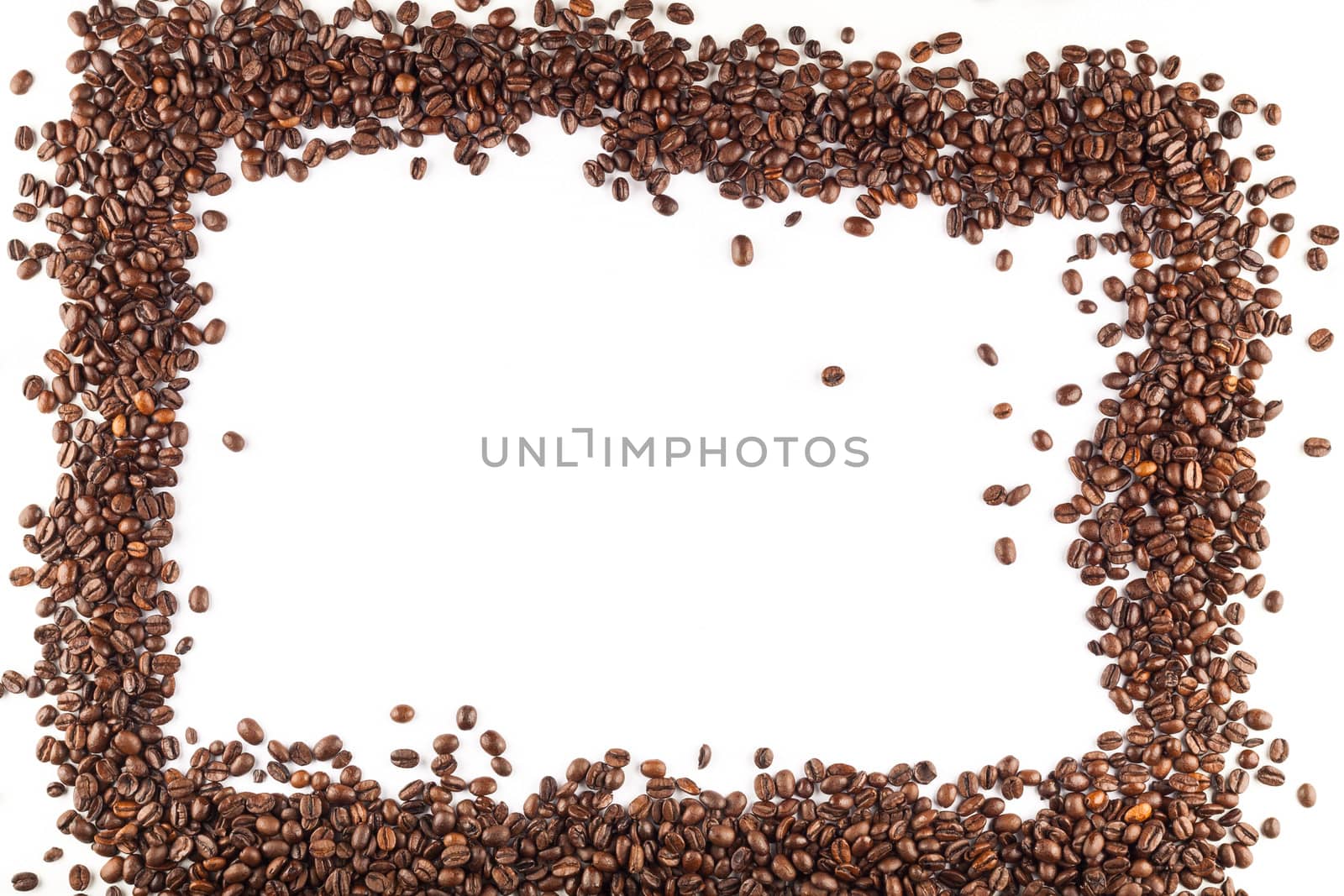 Scattered coffee beans arranged in a frame.