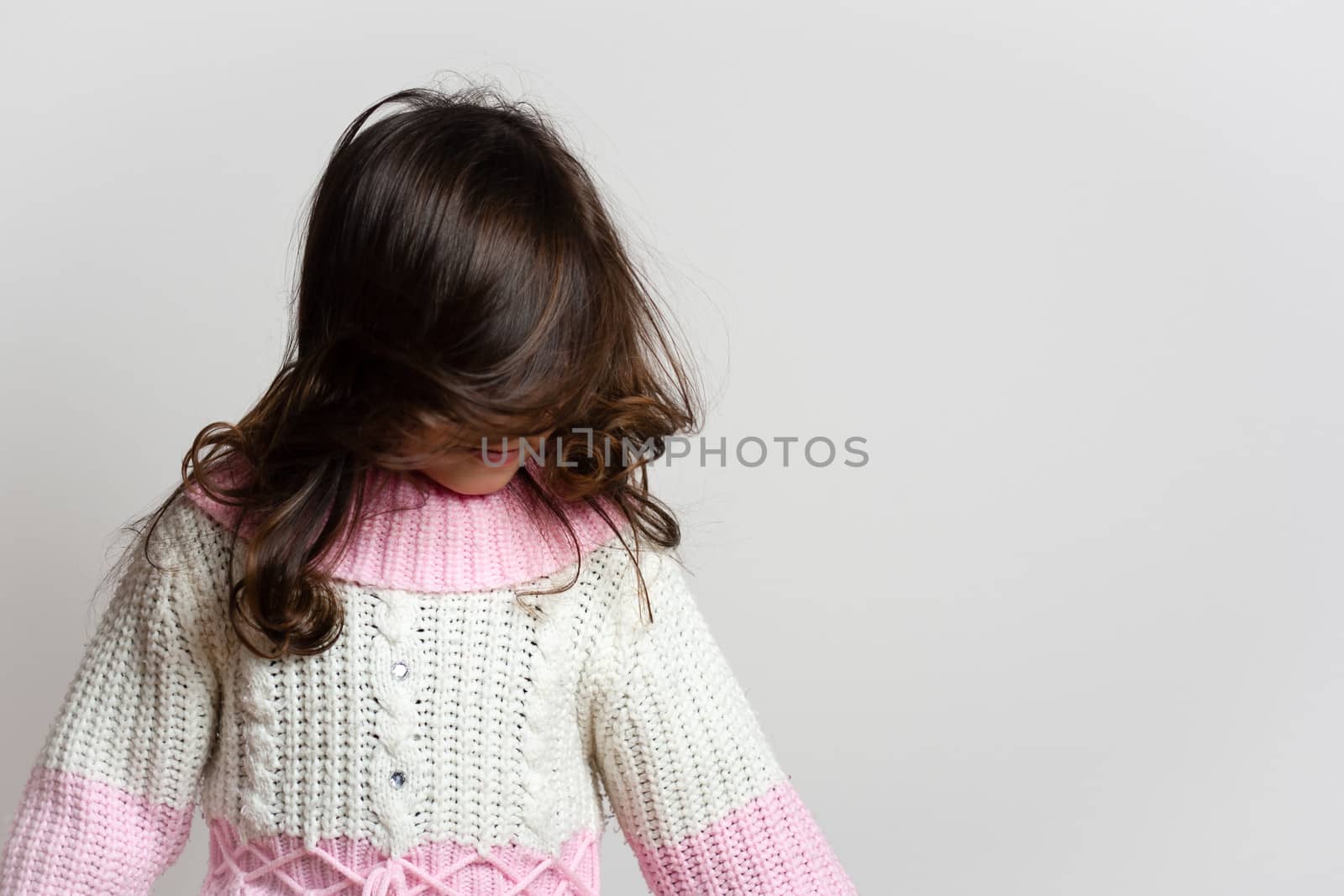 adorable little girl shaking her hair
